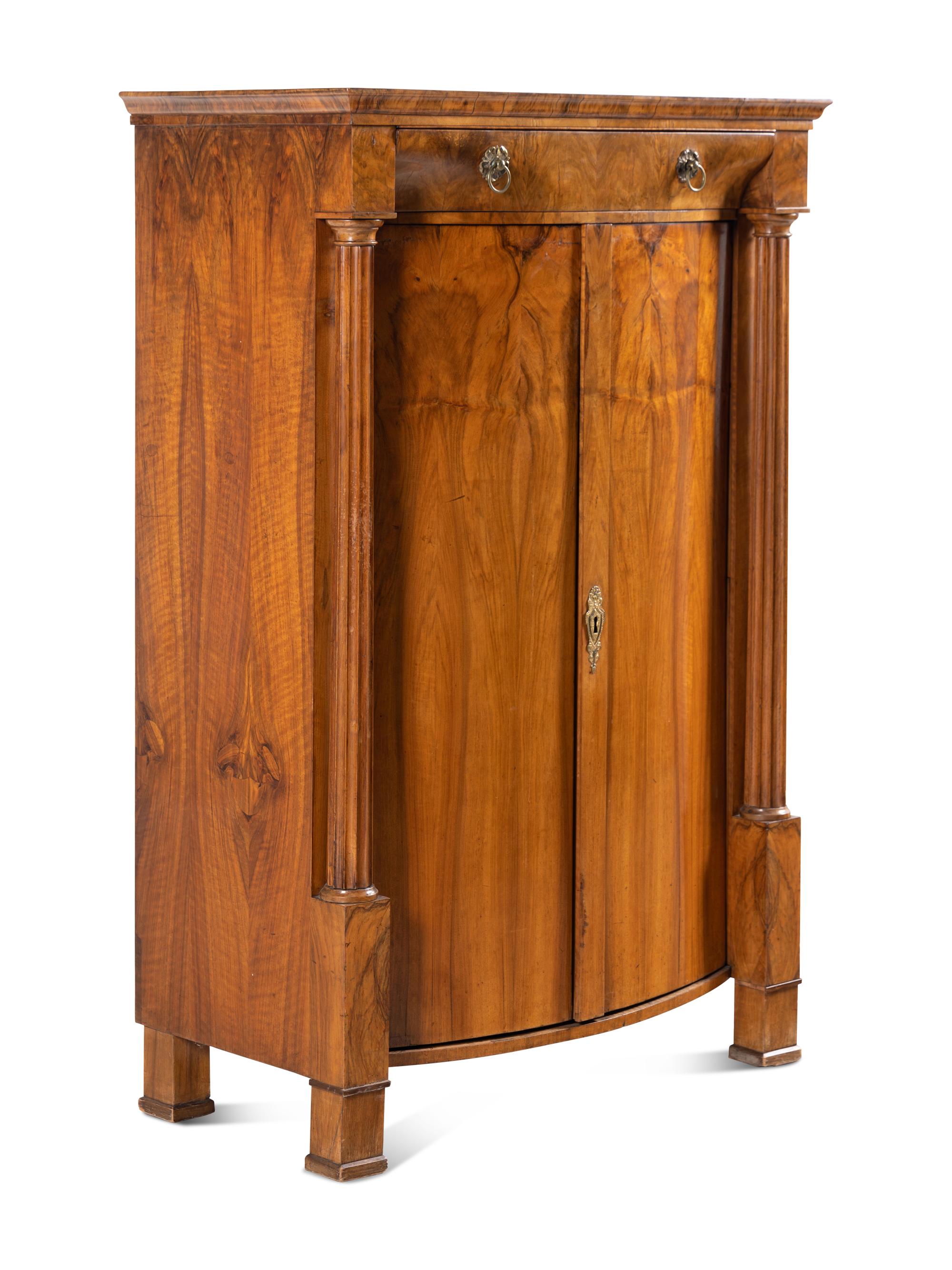 A Biedermeier Figured Walnut Cabinet