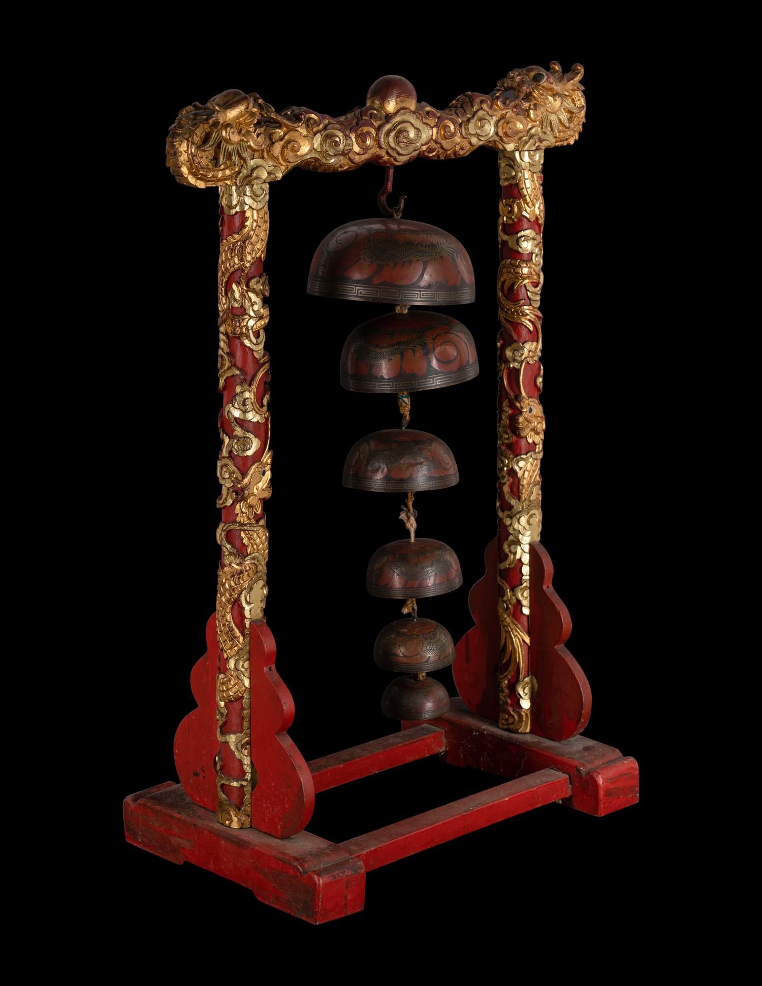 A Set of Gongs with Matching Carved Gilt and Red Lacquered Wood Stand