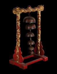 A Set of Gongs with Matching Carved Gilt and Red Lacquered Wood Stand