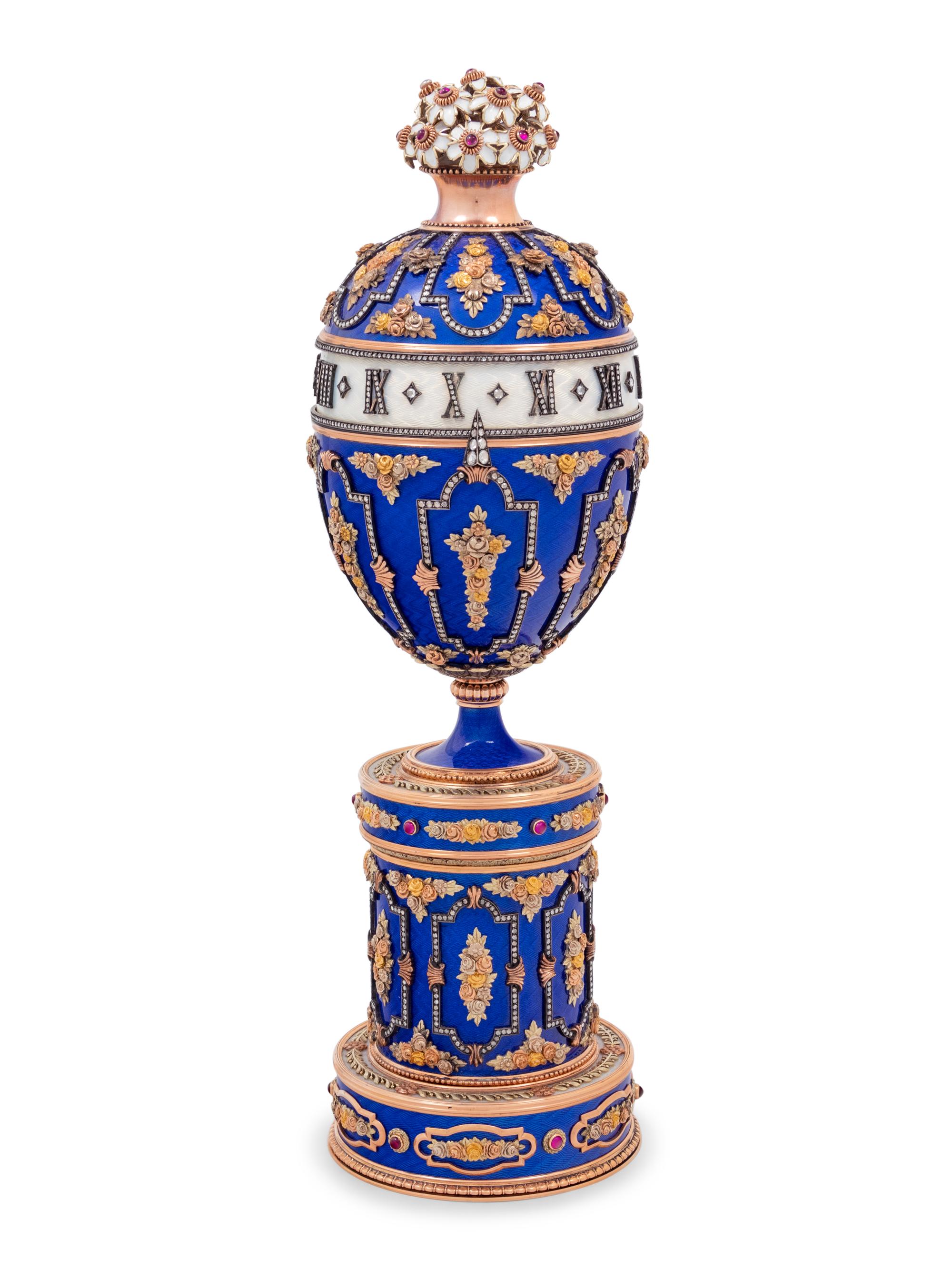 A Gold, Enamel and Diamond Inset Egg-Form Annular Clock