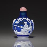 A Chinese White Overlay Blue Glass Snuff Bottle, Qing Dynasty, Possibly 18th-Early 19th Century 清中期 寶石藍地套涅白料垂釣圖鼻烟壺
