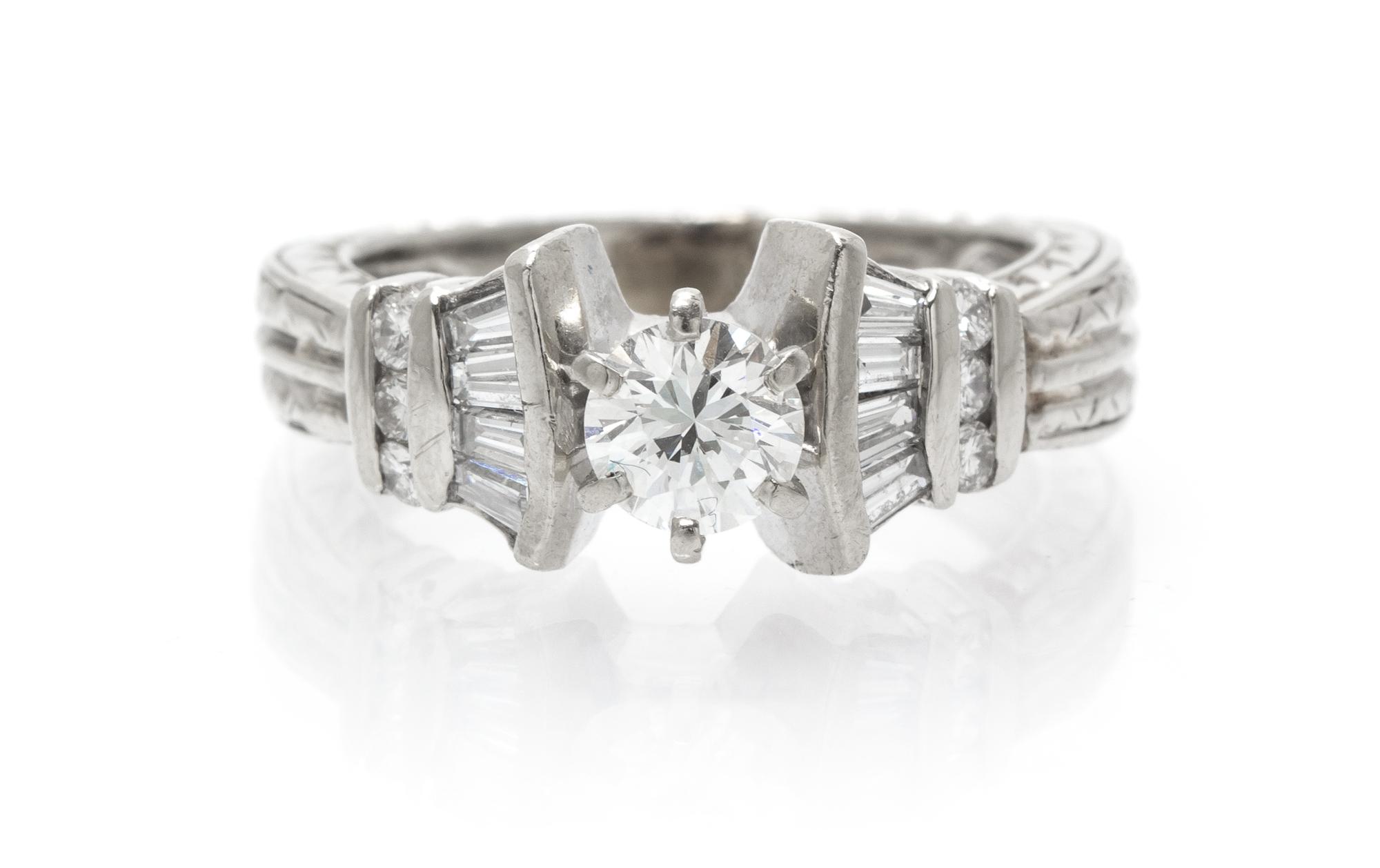 A 14 Karat White Gold and Diamond Ring, 4.10 dwts.