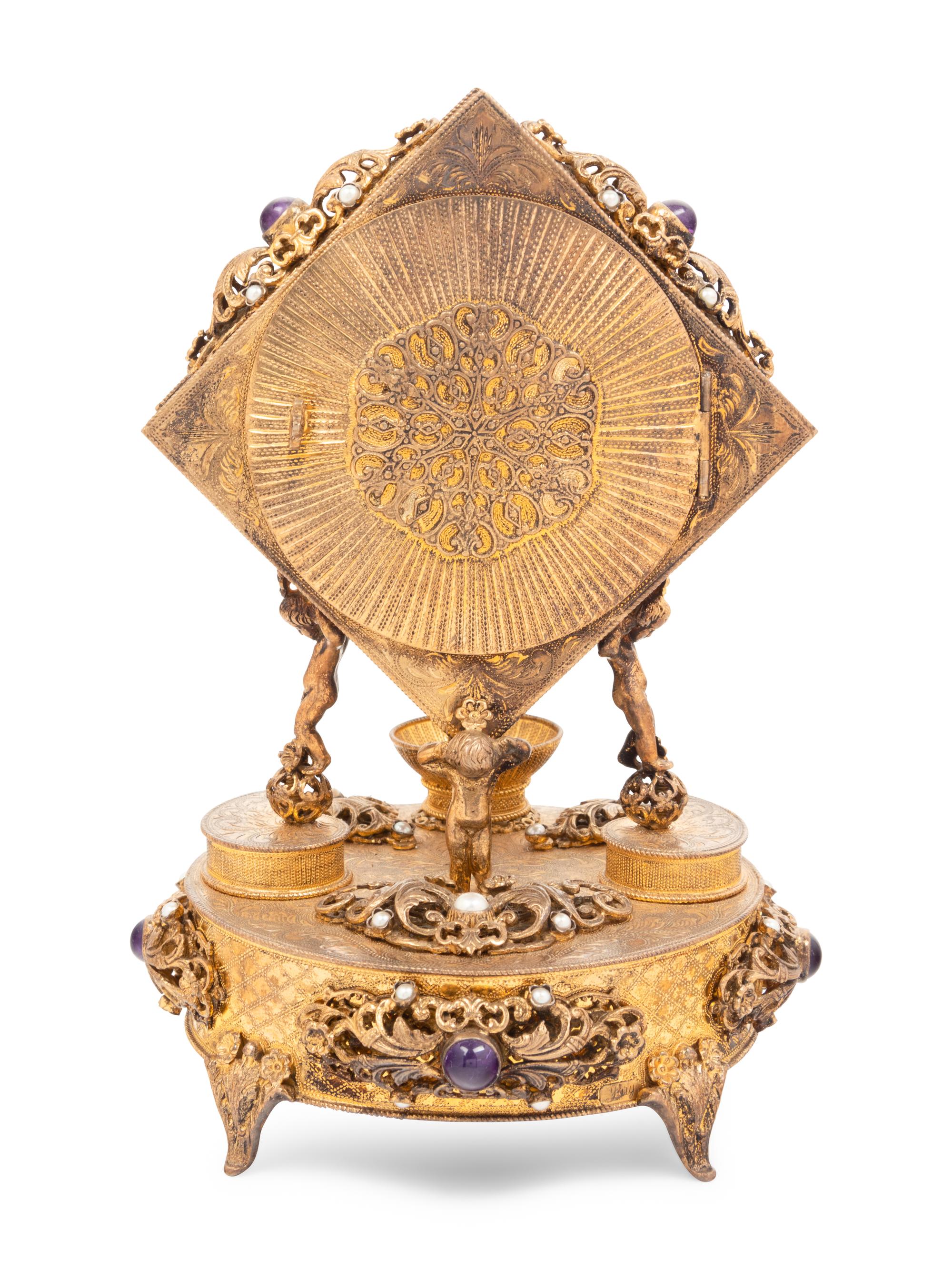 A Neoclassical Style Lapis Lazuli Inset Gilt Metal Mantel Clock