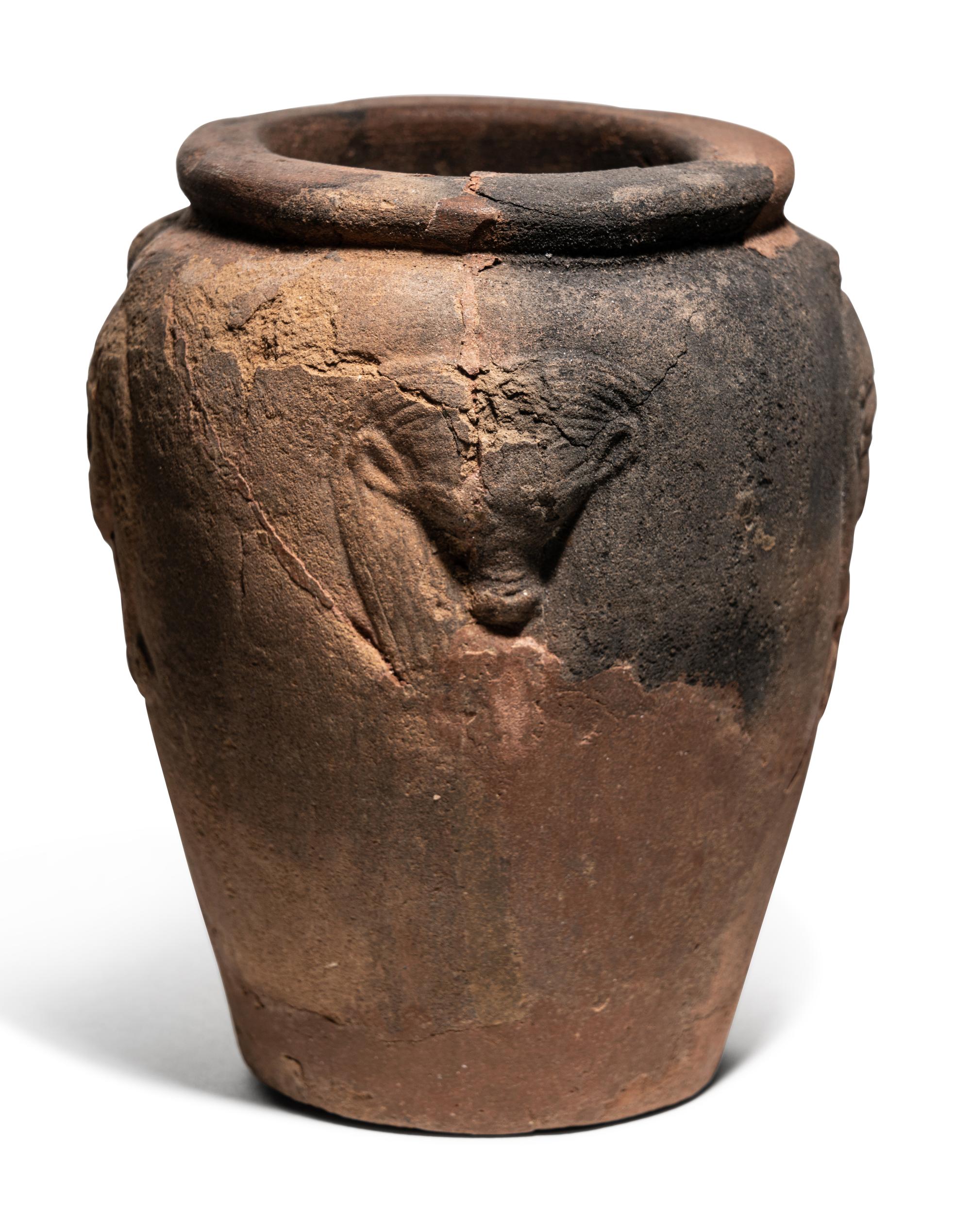 An Egyptian Pottery Jar with Head of Hathor