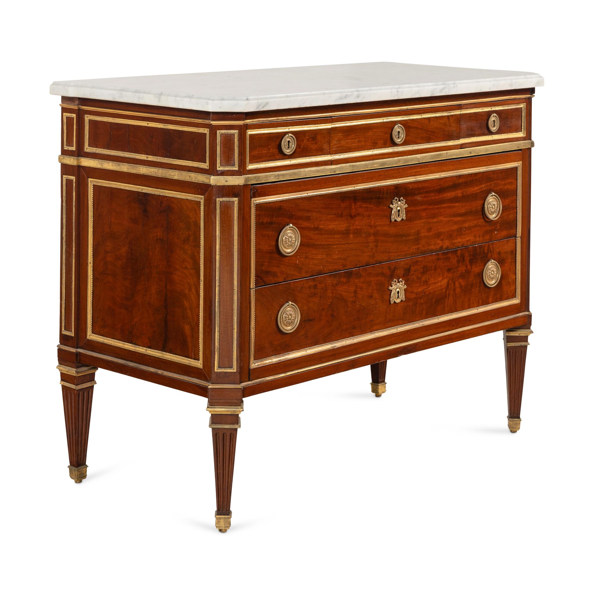 A Louis XVI Gilt Bronze-Mounted Mahogany Marble-Top Commode