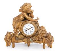 A French Gilt Metal Figural Mantel Clock Width 19 inches.