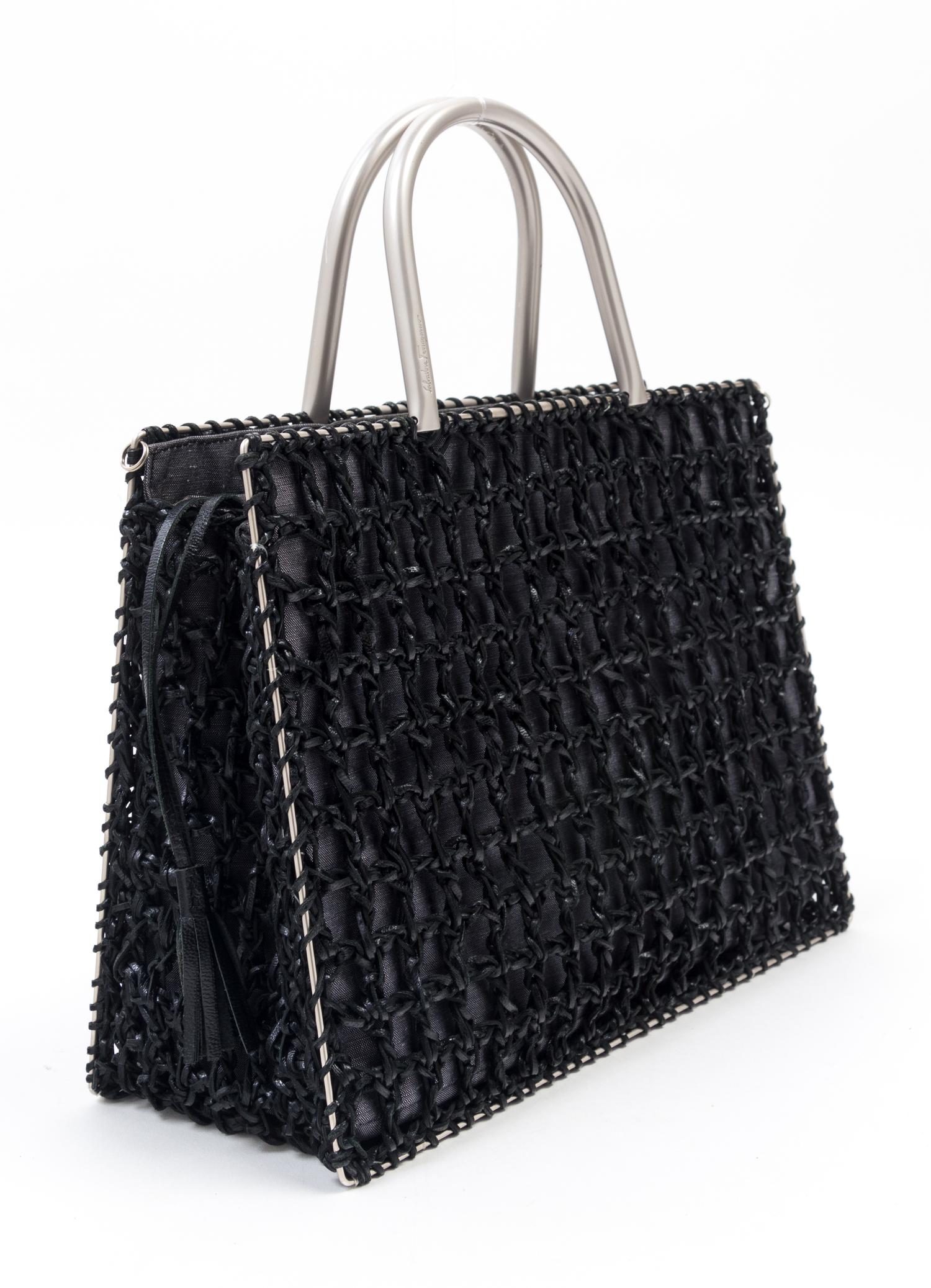 A Salvatore Ferragamo Black Leather Basket Weave Tote, 11" x 8" x 4.5"; Handle drop: 4".