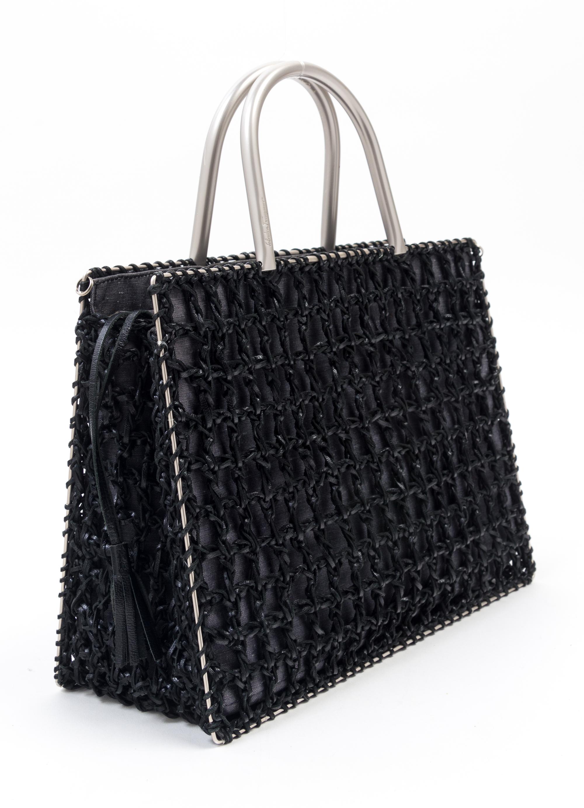 A Salvatore Ferragamo Black Leather Basket Weave Tote, 11" x 8" x 4.5"; Handle drop: 4".