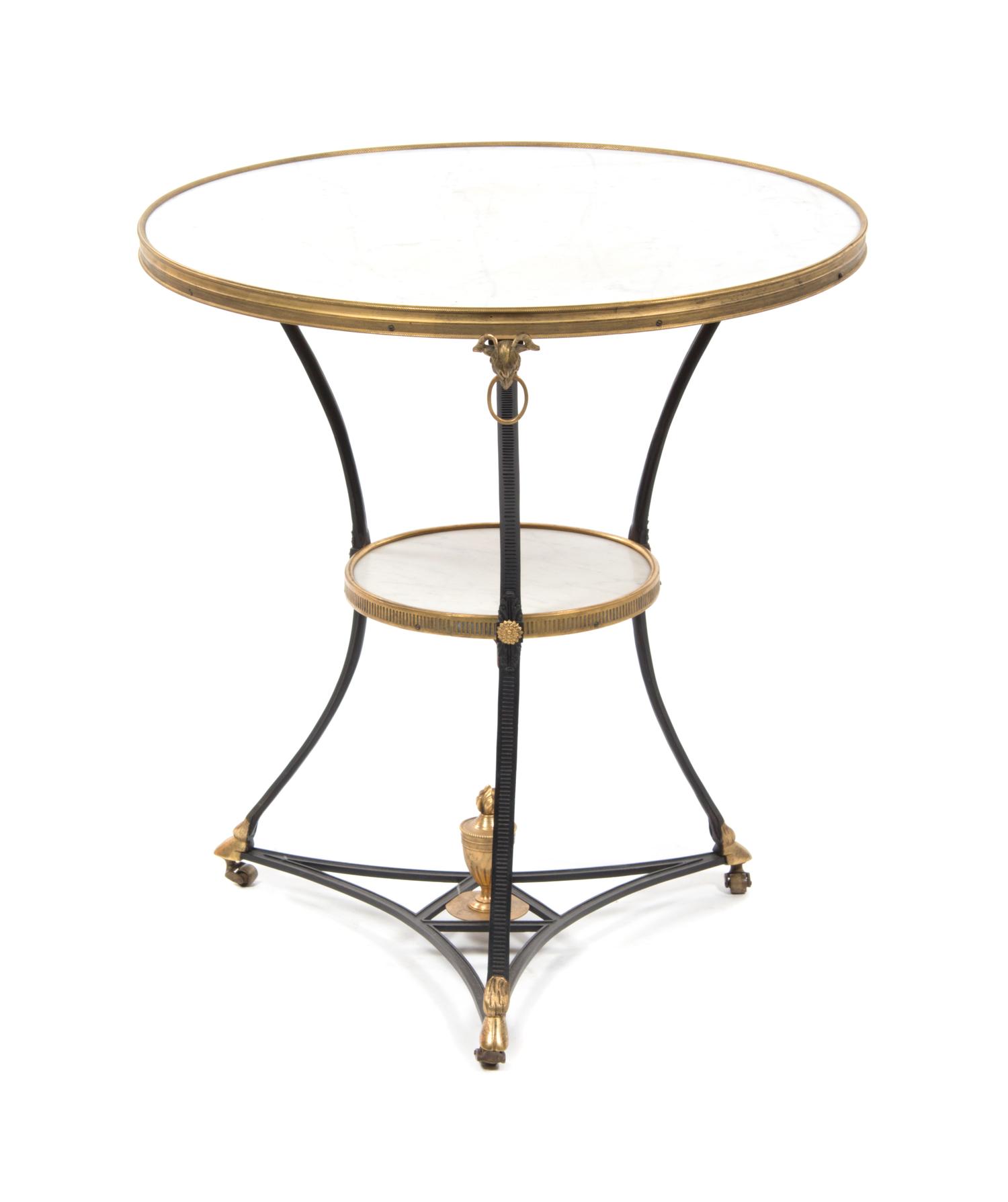 A Continental Gilt and Patinated Bronze Gueridon, Height 28 1/4 x diameter 26 inches.