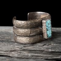 Mitchell Calabaza (Kewa, b. 1959) — Tufa Cast Silver and Turquoise Cuff Bracelet