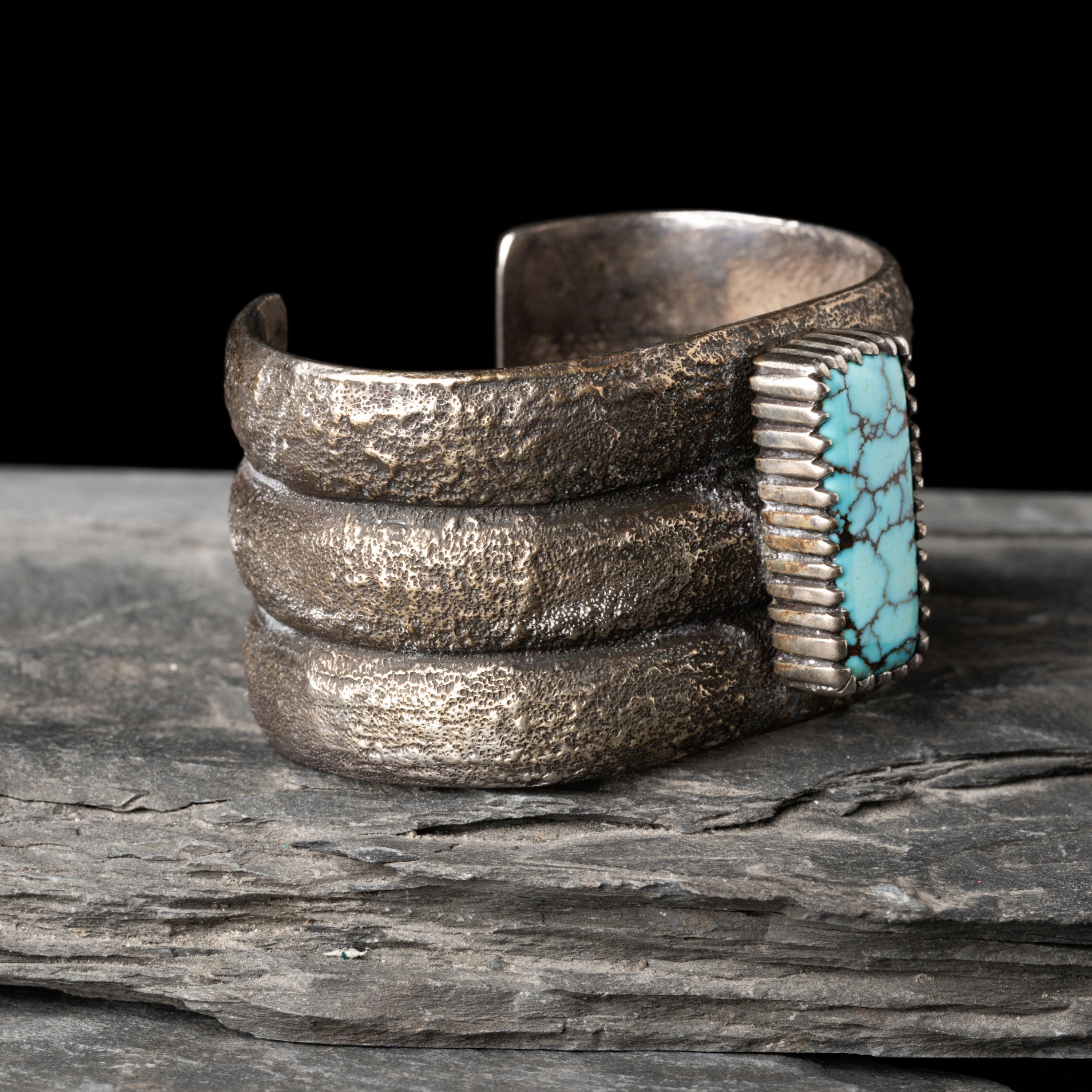 Mitchell Calabaza (Kewa, b. 1959) — Tufa Cast Silver and Turquoise Cuff Bracelet