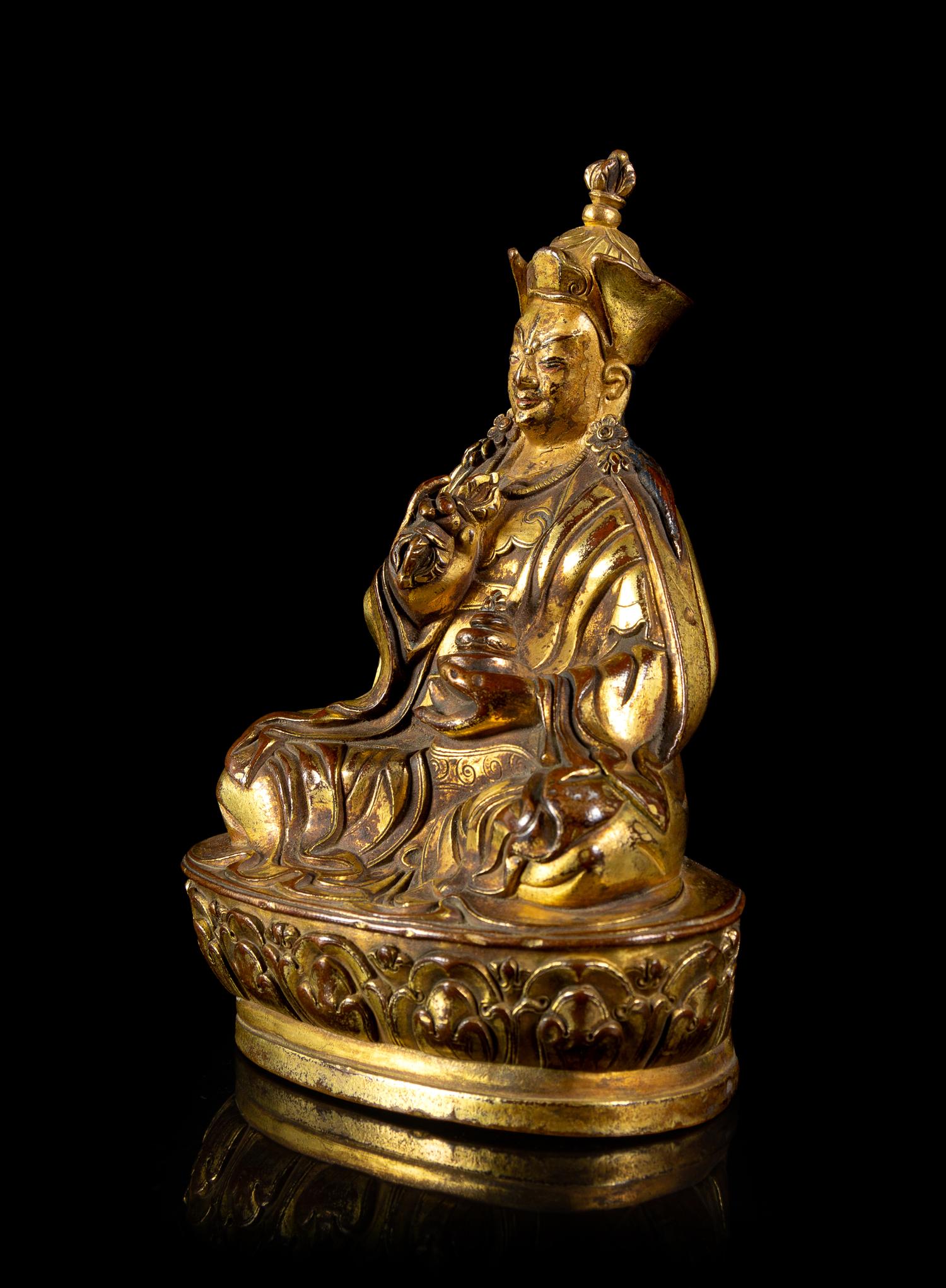 A Small Sino-Tibetan Gilt Bronze Figure of Penchen Lama