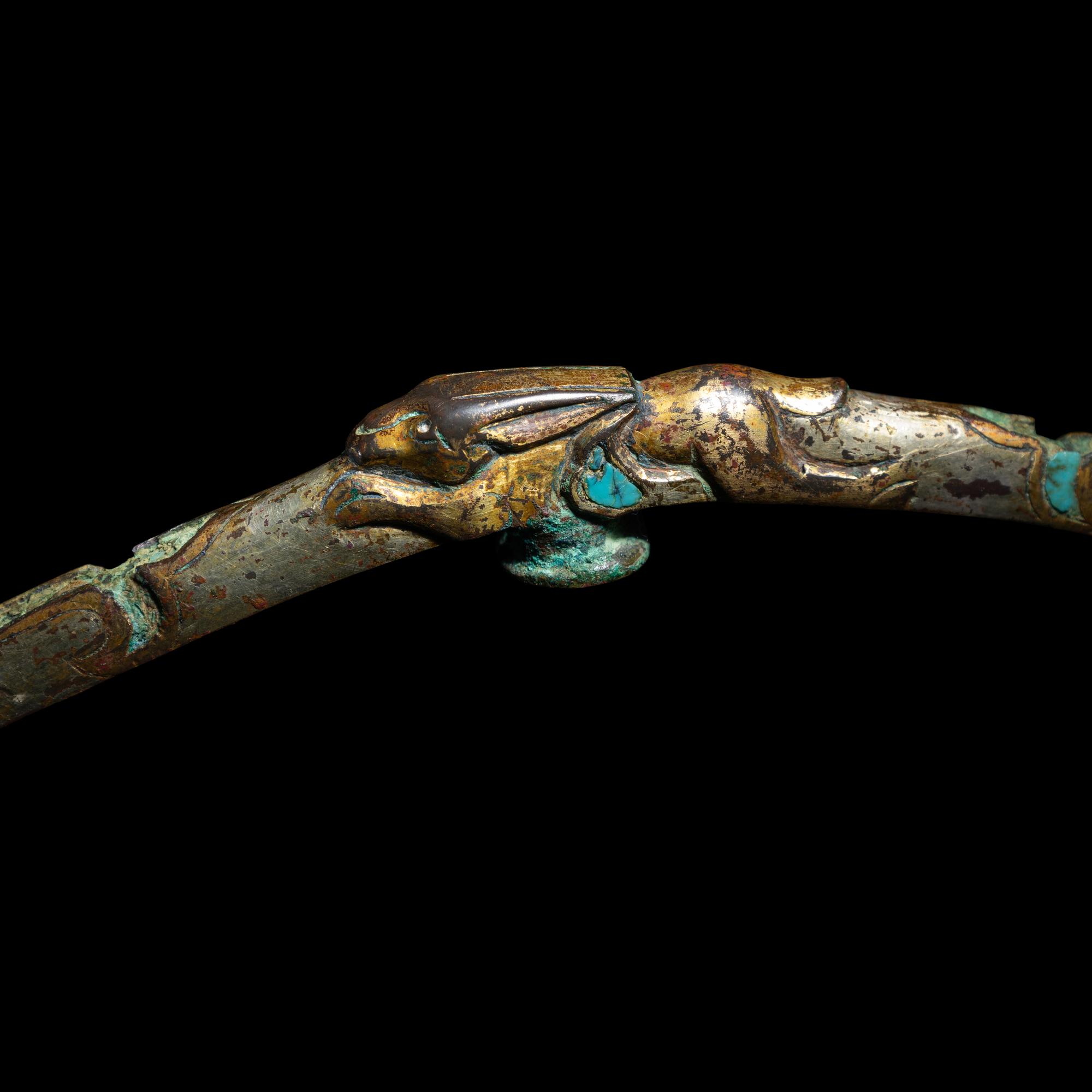 A Chinese Gilt, Silvered and Turquoise Inlaid 'Rabbit' Gold Belt Hook, Warring States Period 戰國 鎏金銅錯銀嵌松石雙獸首奔兔帶鉤
