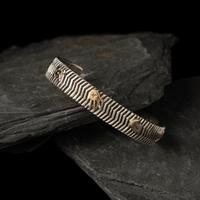 Kee Yazzie (Diné, b. 1969) — Sterling Silver and 14K Gold Petroglyph Cuff Bracelet
