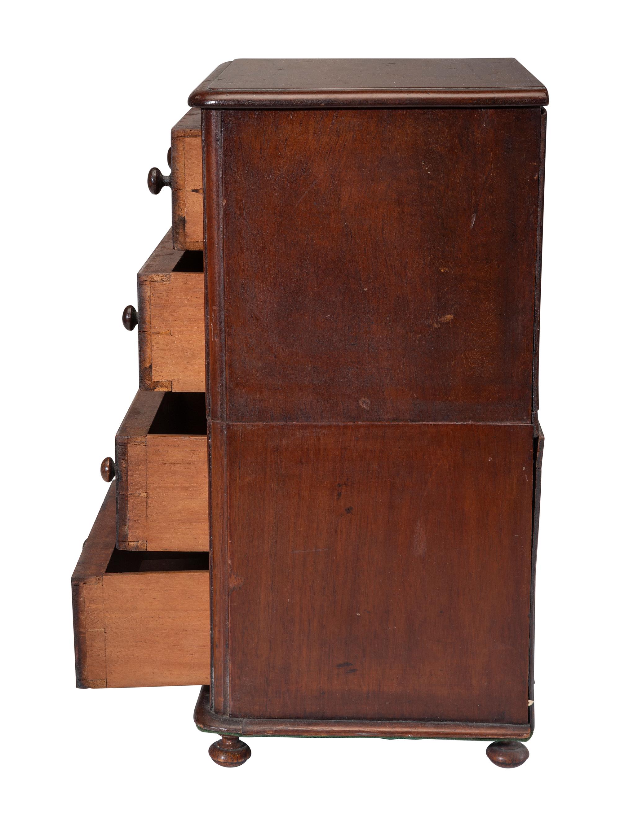 A Miniature Cherry Four-Drawer Chest