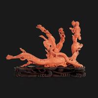 A Chinese carved coral "Dragon, Boy, and Meiren" group