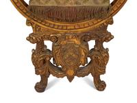 An Italian Giltwood Savonarola Armchair