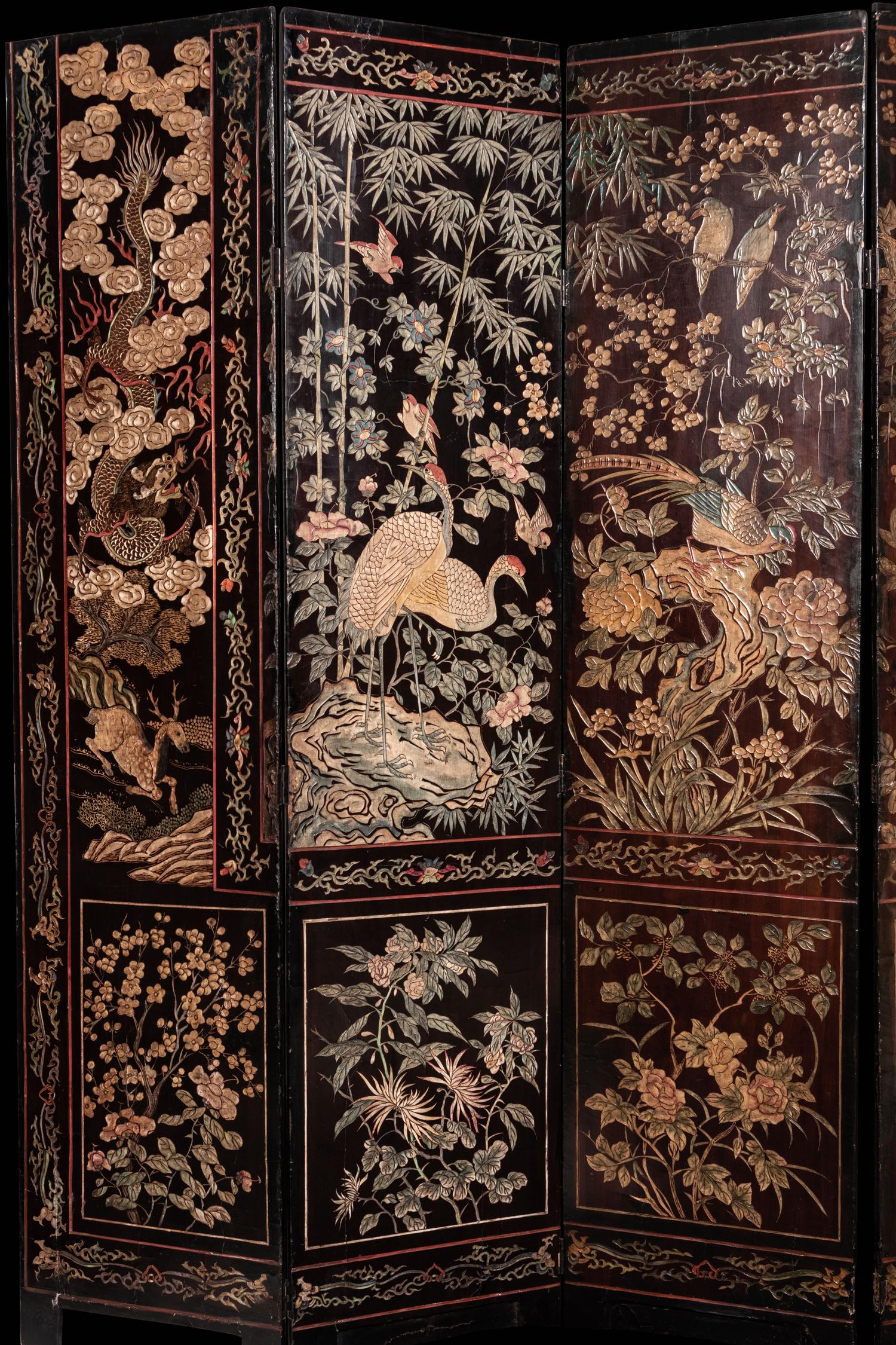 A Coromandel Lacquer Eight-Panel Floor Screen