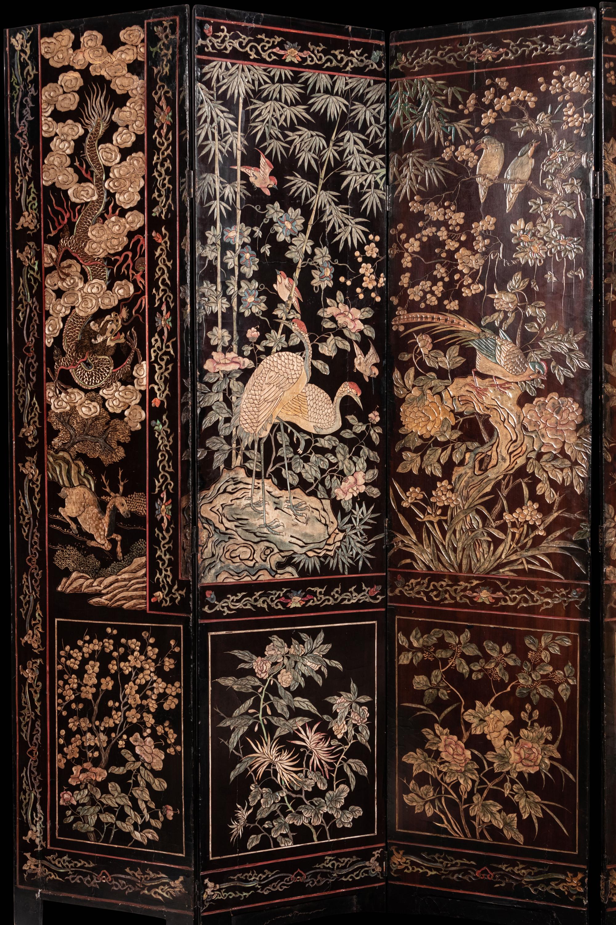 A Coromandel Lacquer Eight-Panel Floor Screen