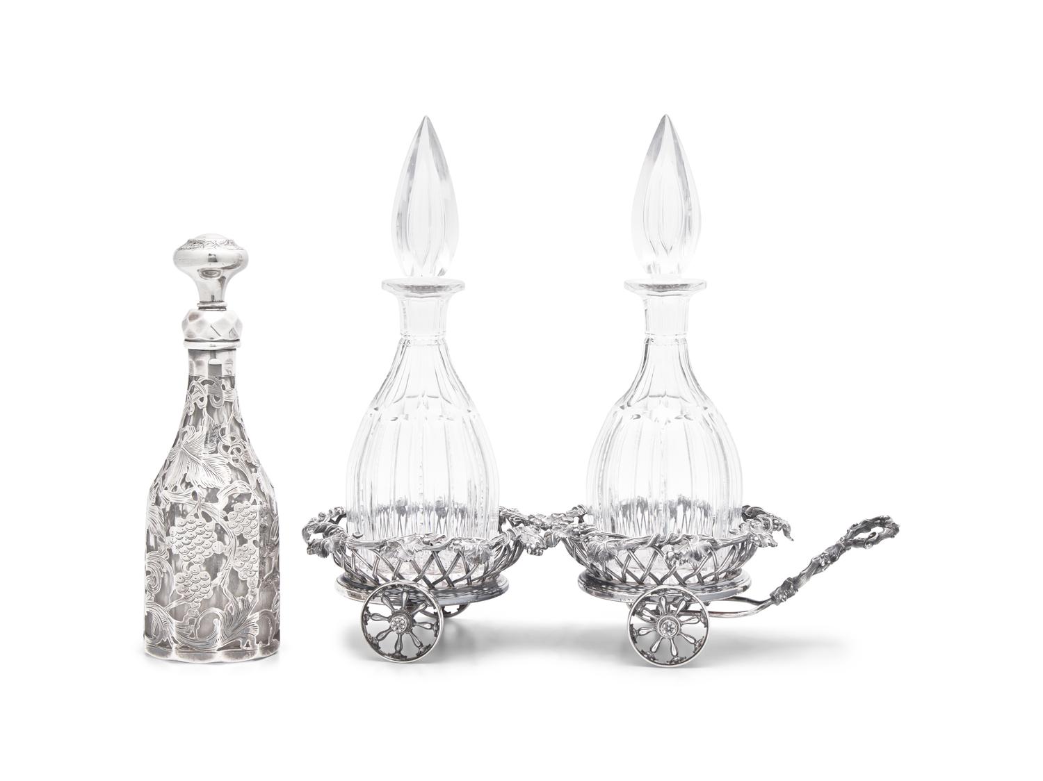 A Victorian Silver-Plated Wine Trolley and Three Glass Decanters