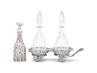 A Victorian Silver-Plated Wine Trolley and Three Glass Decanters