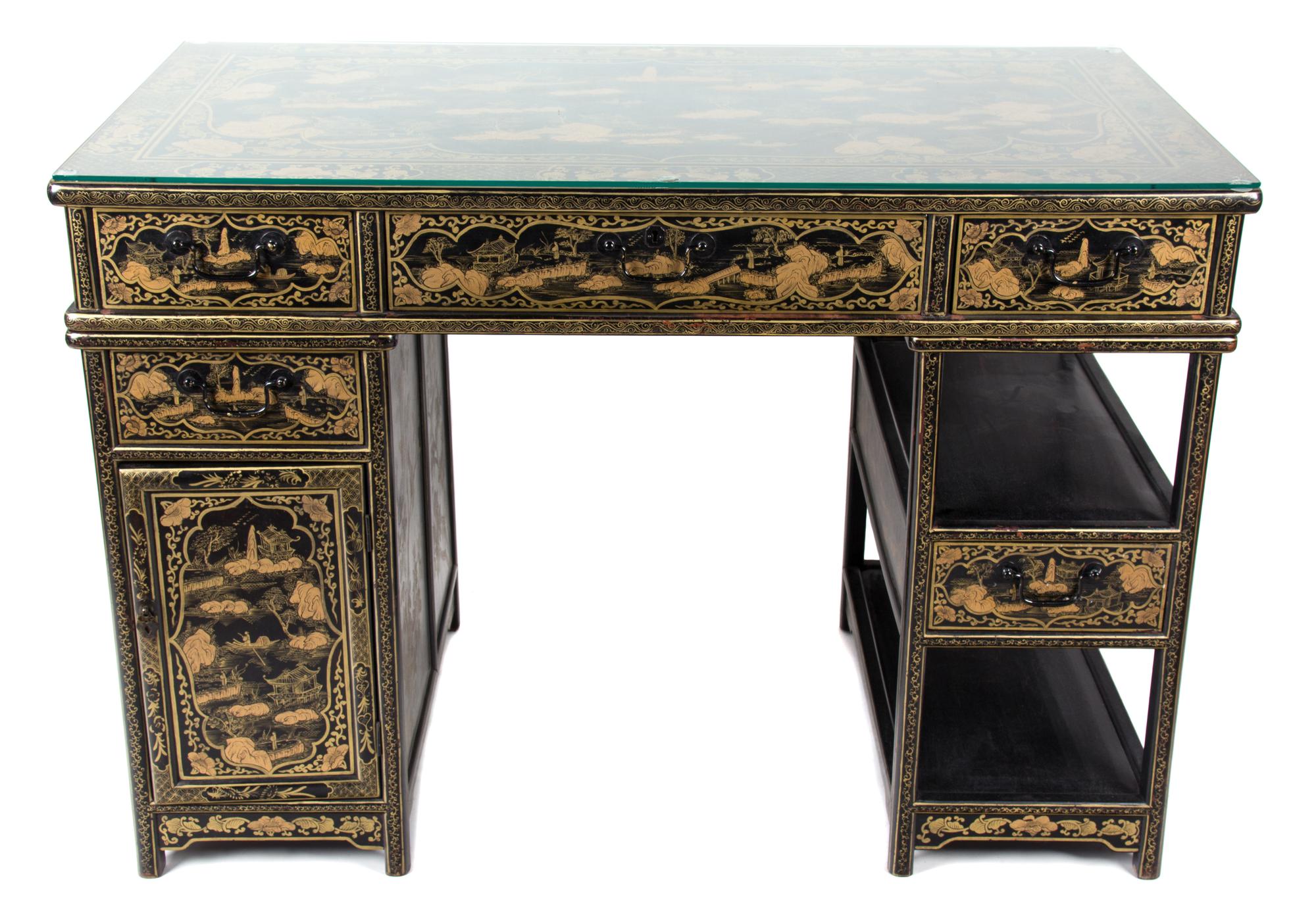 A Chinese Black and Gilt Lacquered Desk Height 33 x width 47 x depth 25 1/2 inches. — 20TH CENTURY