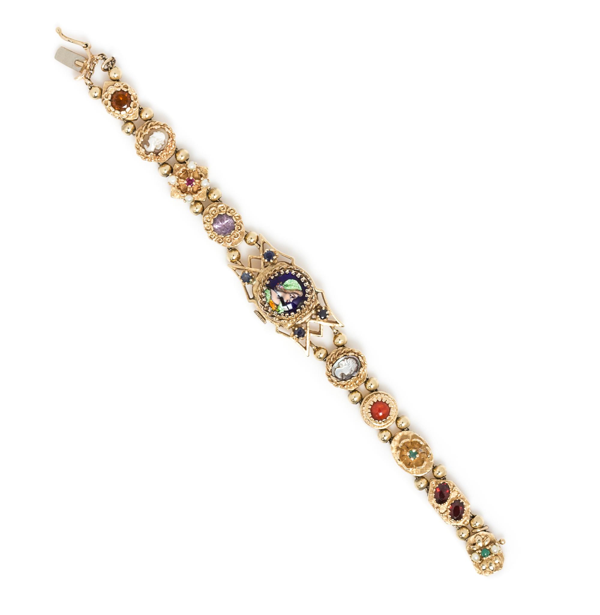 A Yellow Gold, Polychrome Enamel and Multigem Slide Surprise Wristwatch, 25.50 dwts.