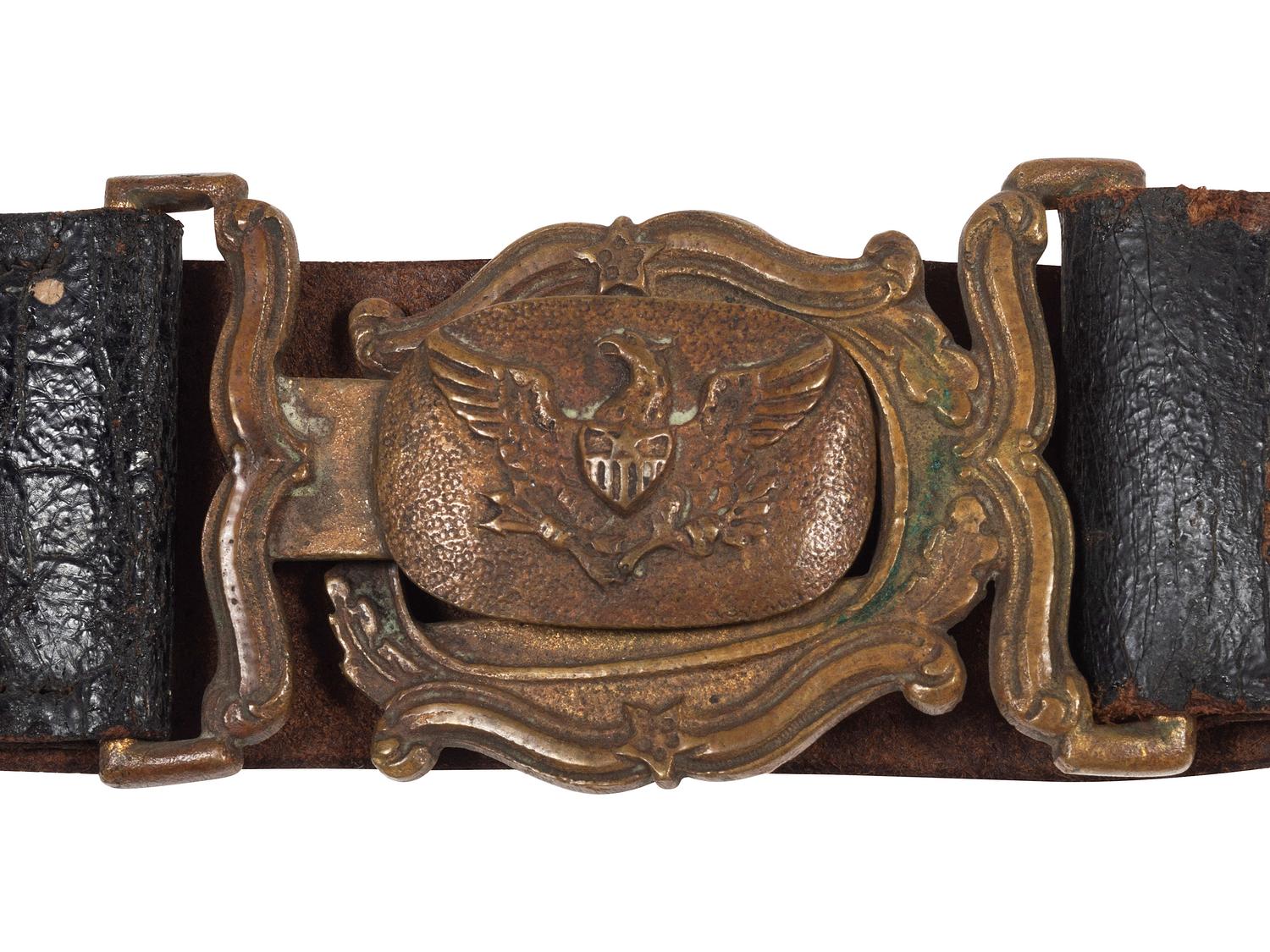 [MILITIA]. A group of pre-Civil War items, including ca 1850s militia belt and belt plate, officer's sash, and epaulettes.