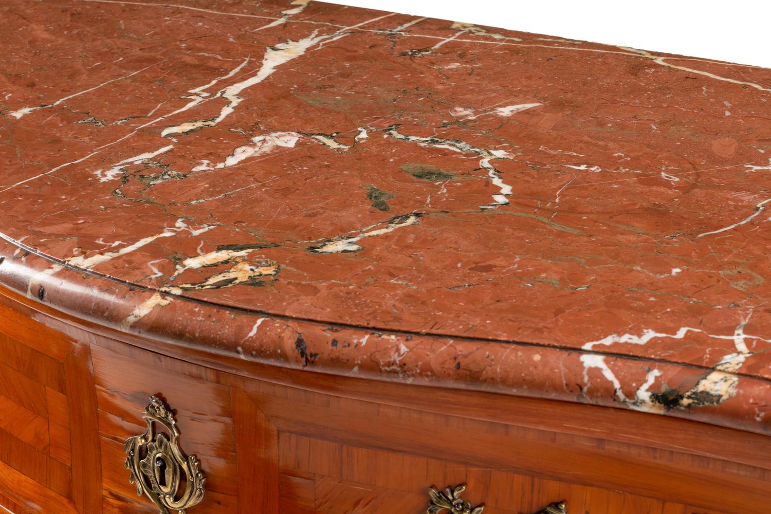 A Régence Style Gilt Bronze Mounted Parquetry Marble-Top Commode