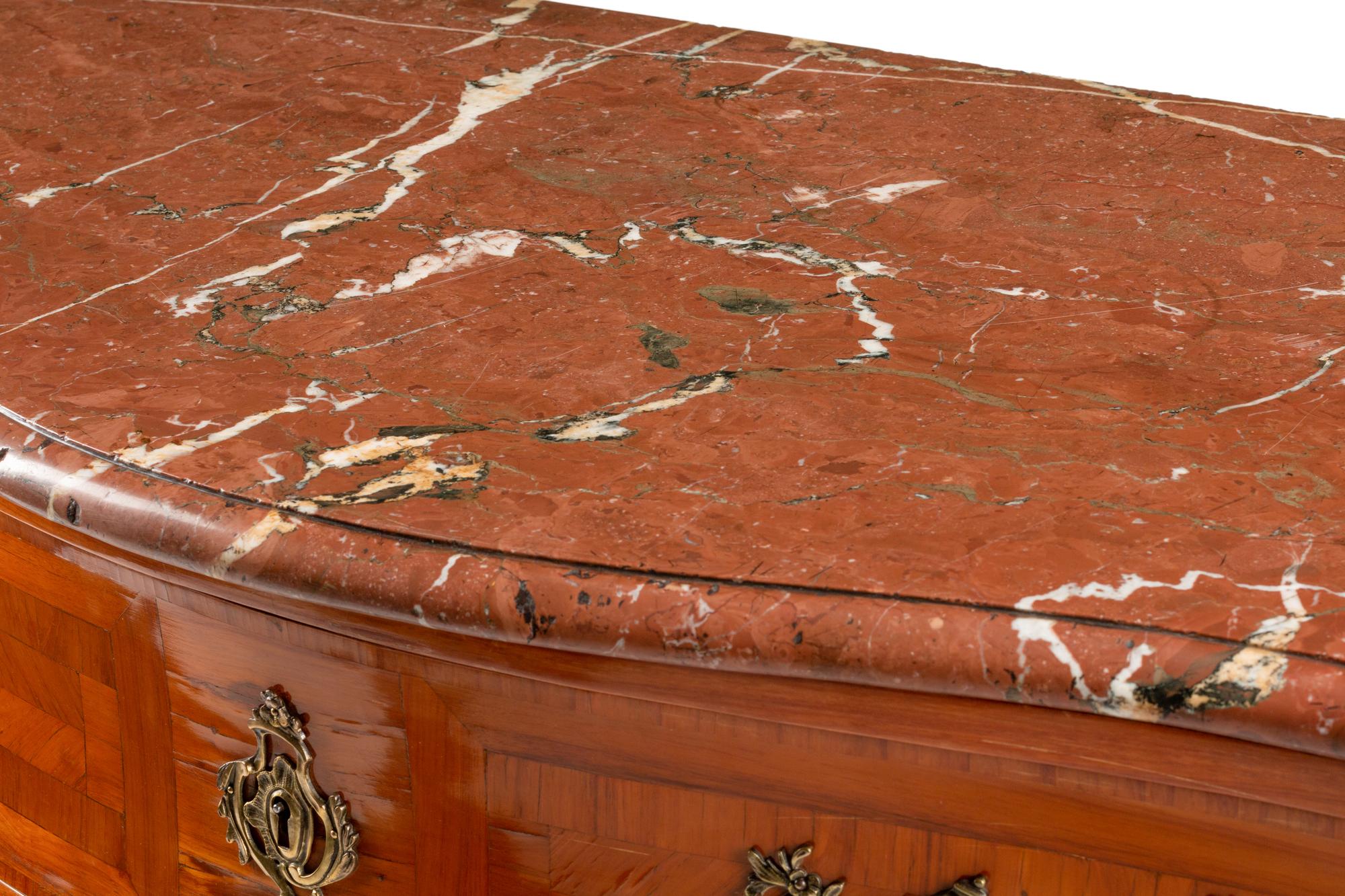 A Régence Style Gilt Bronze Mounted Parquetry Marble-Top Commode