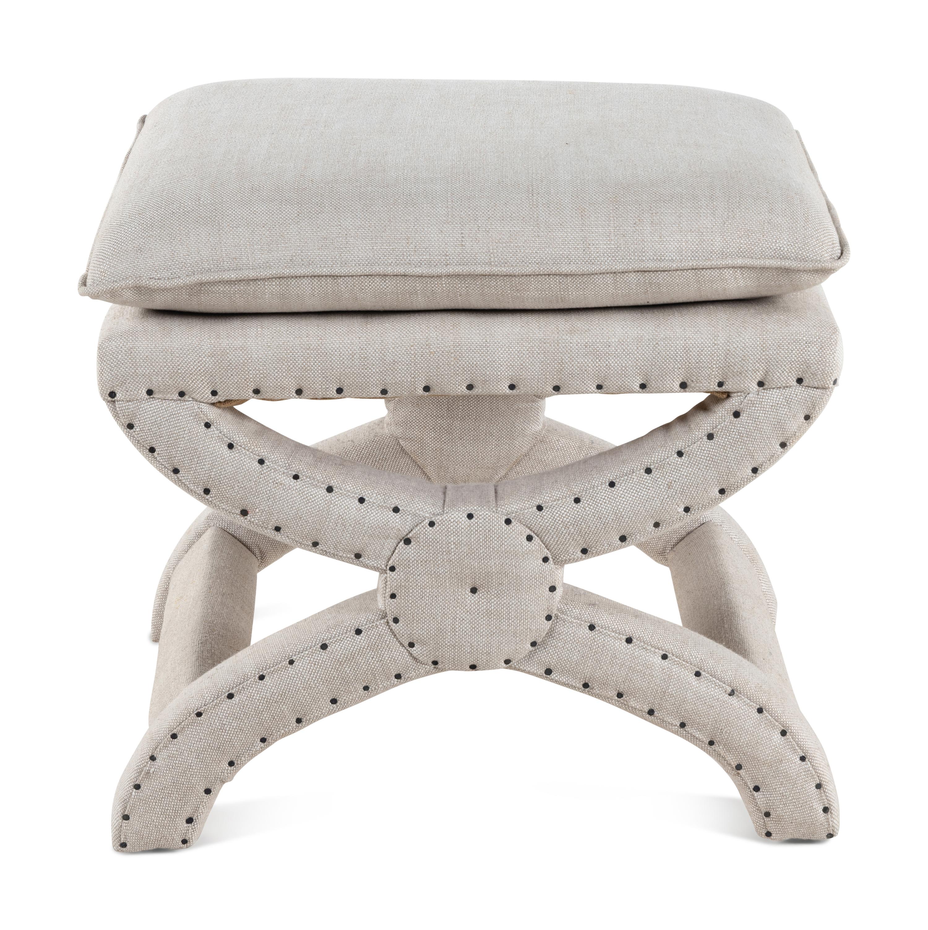 A Contemporary Linen-Upholstered X-Form Stool