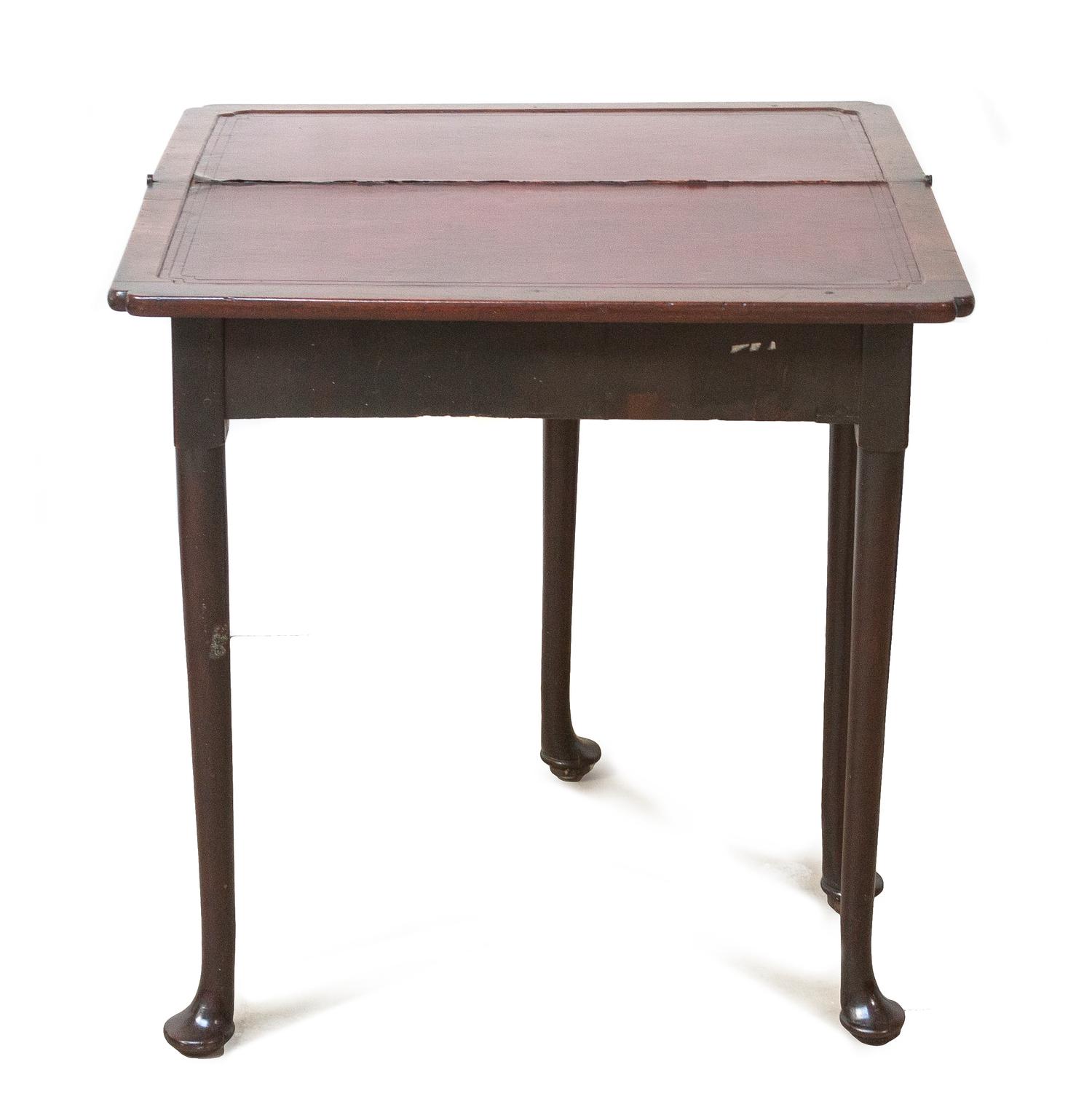 A Queen Anne Style Walnut Games Table, Height 29 x width 14 1/2 x depth 29 1/2 inches (closed).