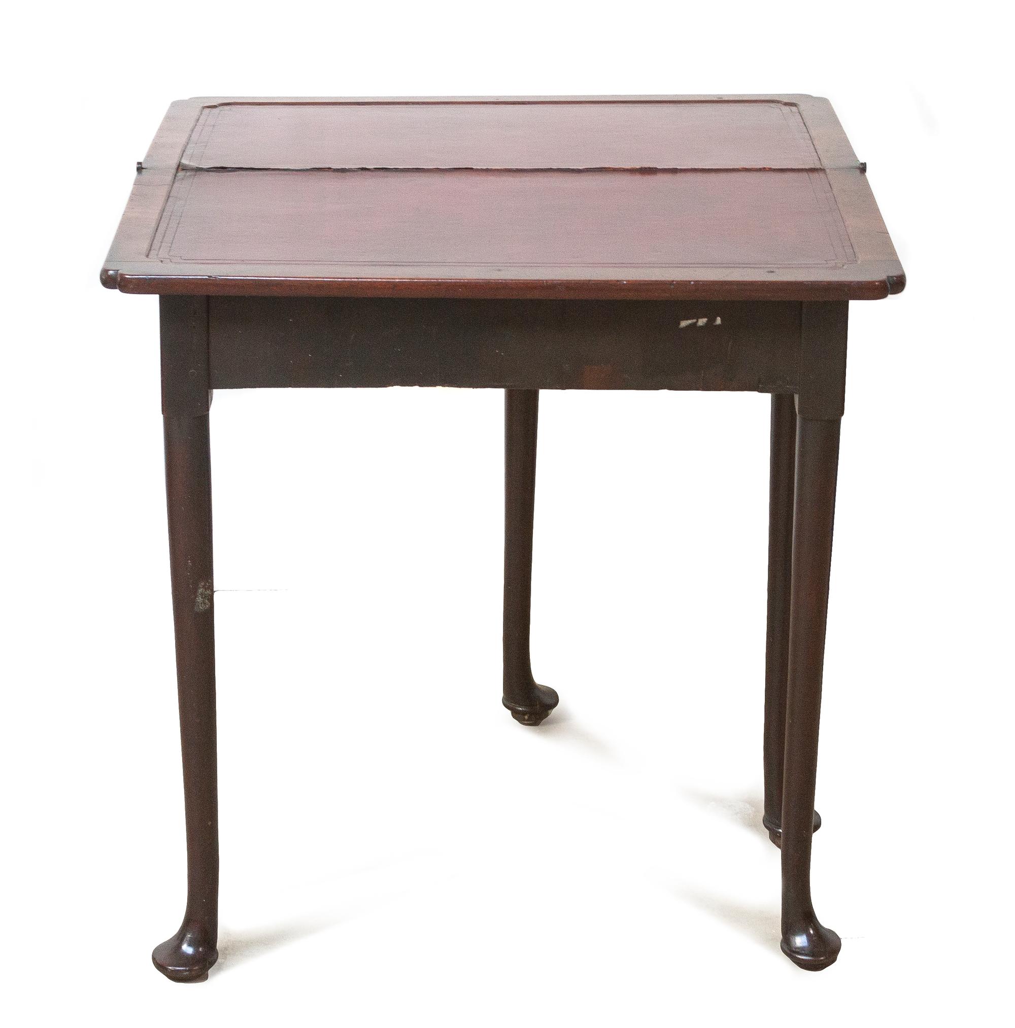A Queen Anne Style Walnut Games Table, Height 29 x width 14 1/2 x depth 29 1/2 inches (closed).