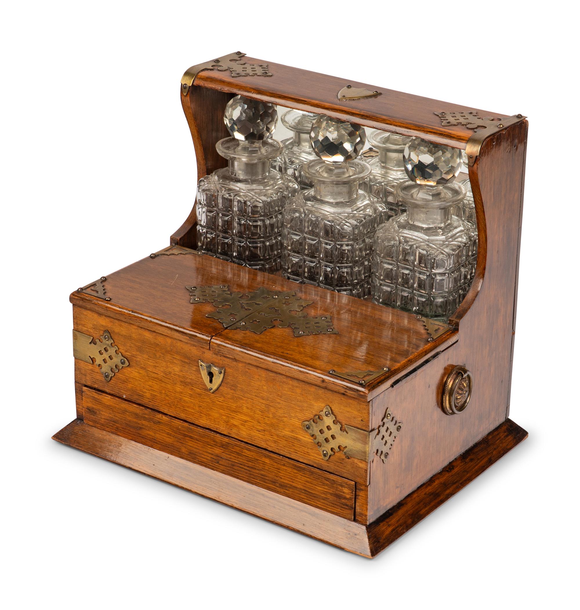 A Victorian Oak and Brass-Mounted Tantalus and a Walnut Letter Box