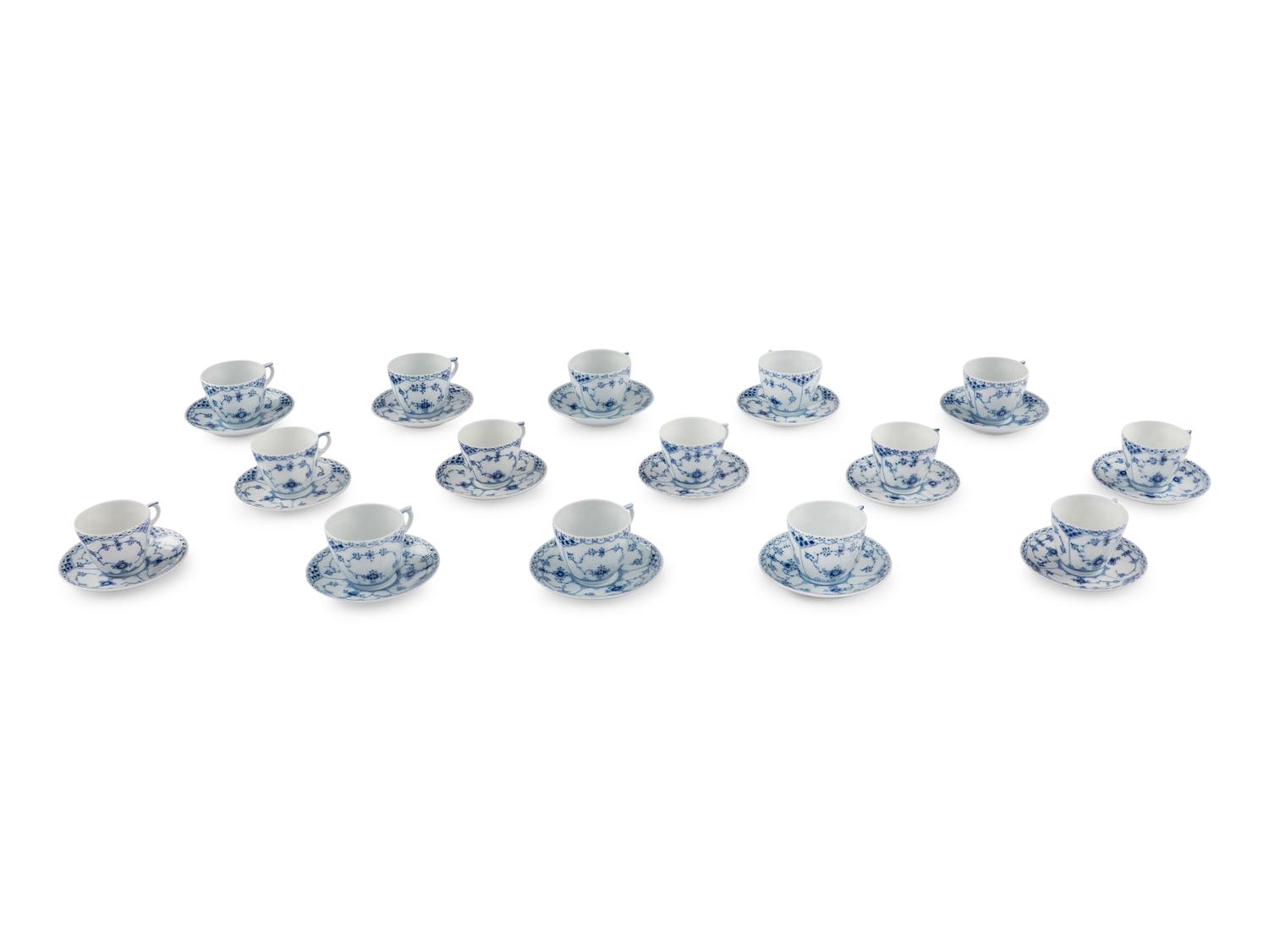 A Group of Royal Copenhagen Blue Fluted Teacups and Saucers