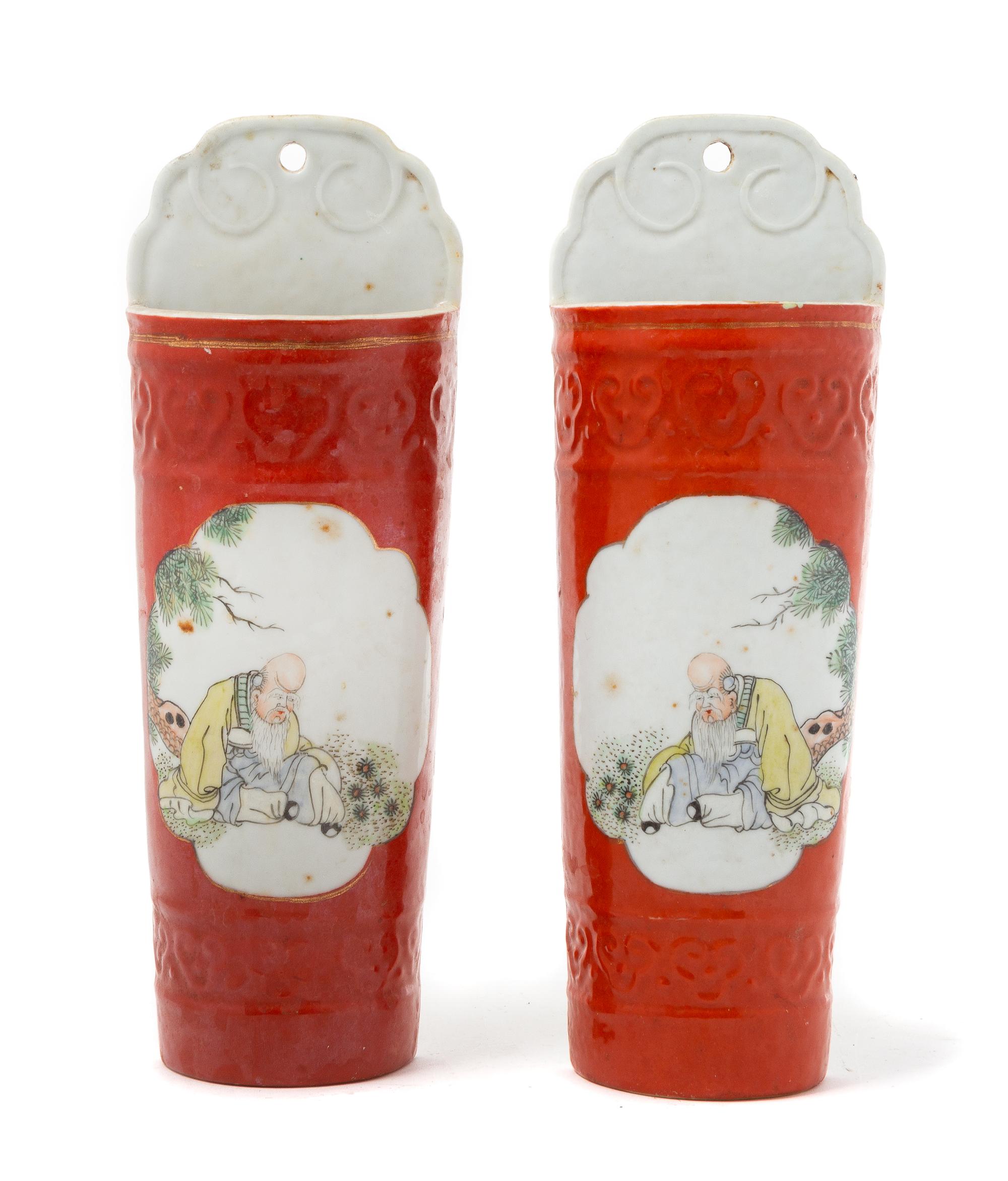 A Pair of Chinese Iron Red Ground Famille Rose Wall Vases Height of each 10 1/2 inches. — LATE QING DYNASTY