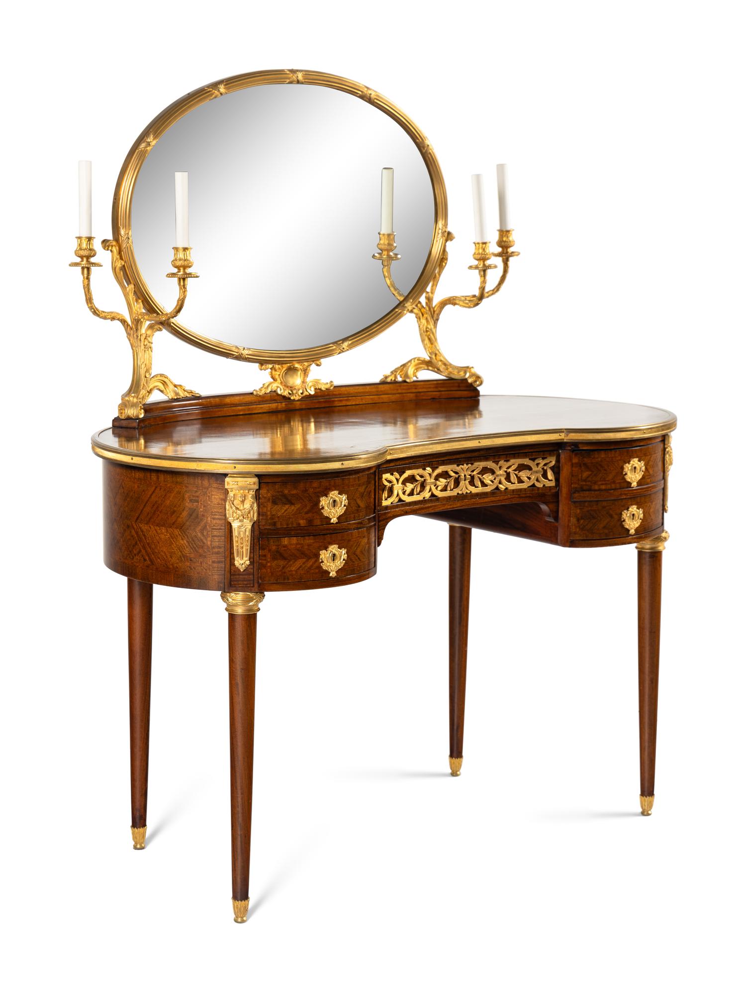 A Louis XVI Style Gilt Bronze Mounted Mahogany Dressing Table and Mirror