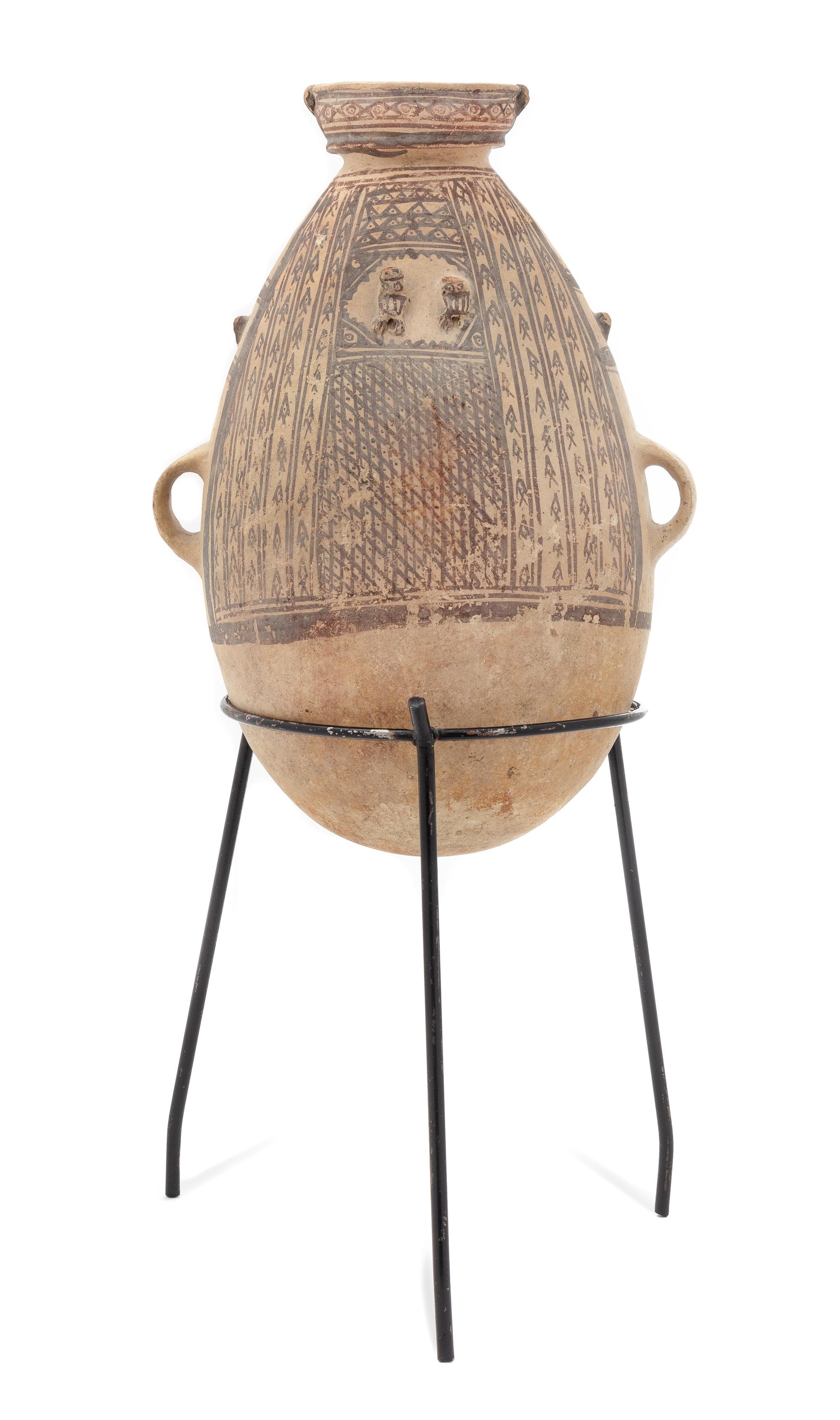 A Chancay Pottery Vessel Height of vessel 15 3/8 inches. — PERU, CIRCA 1200-1450 C.E.