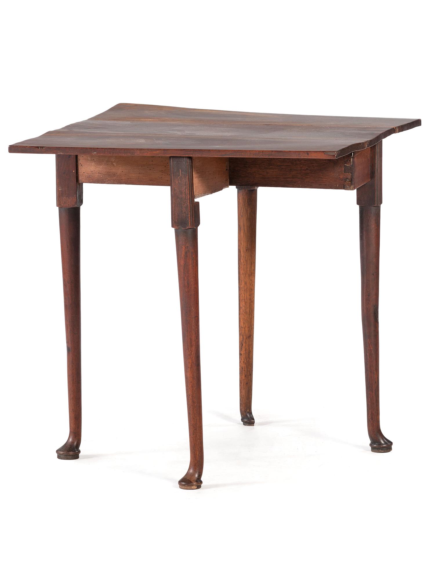 A George III Figured Mahogany Pad-Foot Drop-Leaf Table