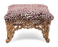 A Brass Foot Stool with Cheetah Print Upholstery