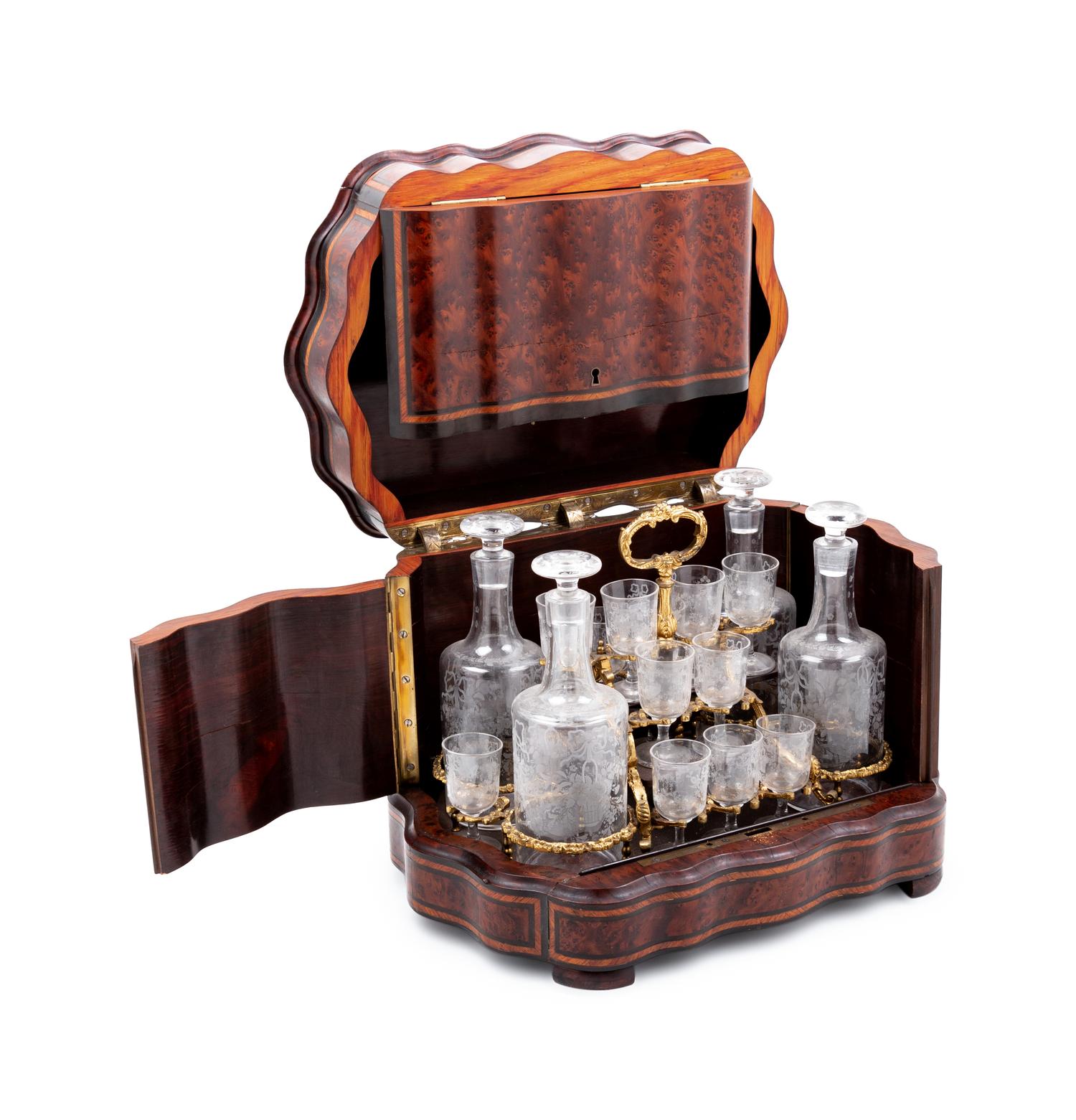 A Napoleon III Parcel Ebonized Amboyna Cave à Liqueur