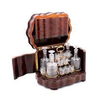 A Napoleon III Parcel Ebonized Amboyna Cave à Liqueur