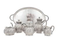 A Tiffany and Co. Silver Repoussé Five-Piece Tea and Coffee Service