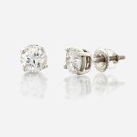 A pair of diamond and white metal earrings