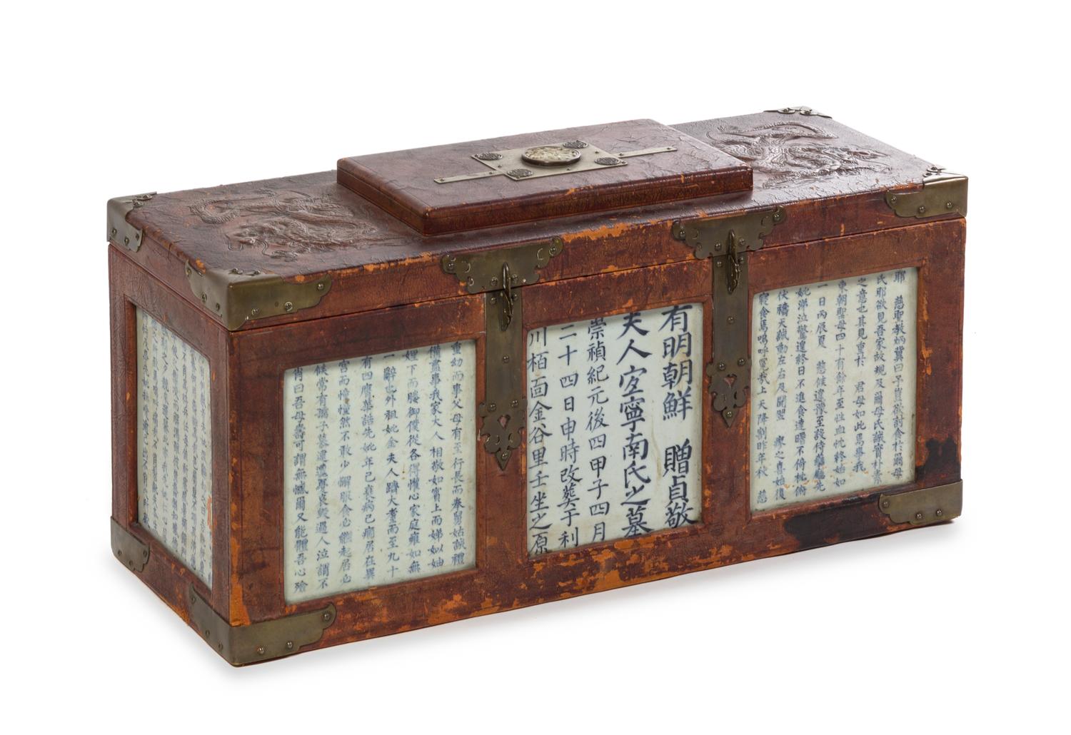 A Large Korean Leather and Porcelain-Inset Chest 18TH/19TH CENTURY Height 14 1/4 x width 29 1/4 x depth 11 1/4 inches. — 18TH/19TH CENTURY