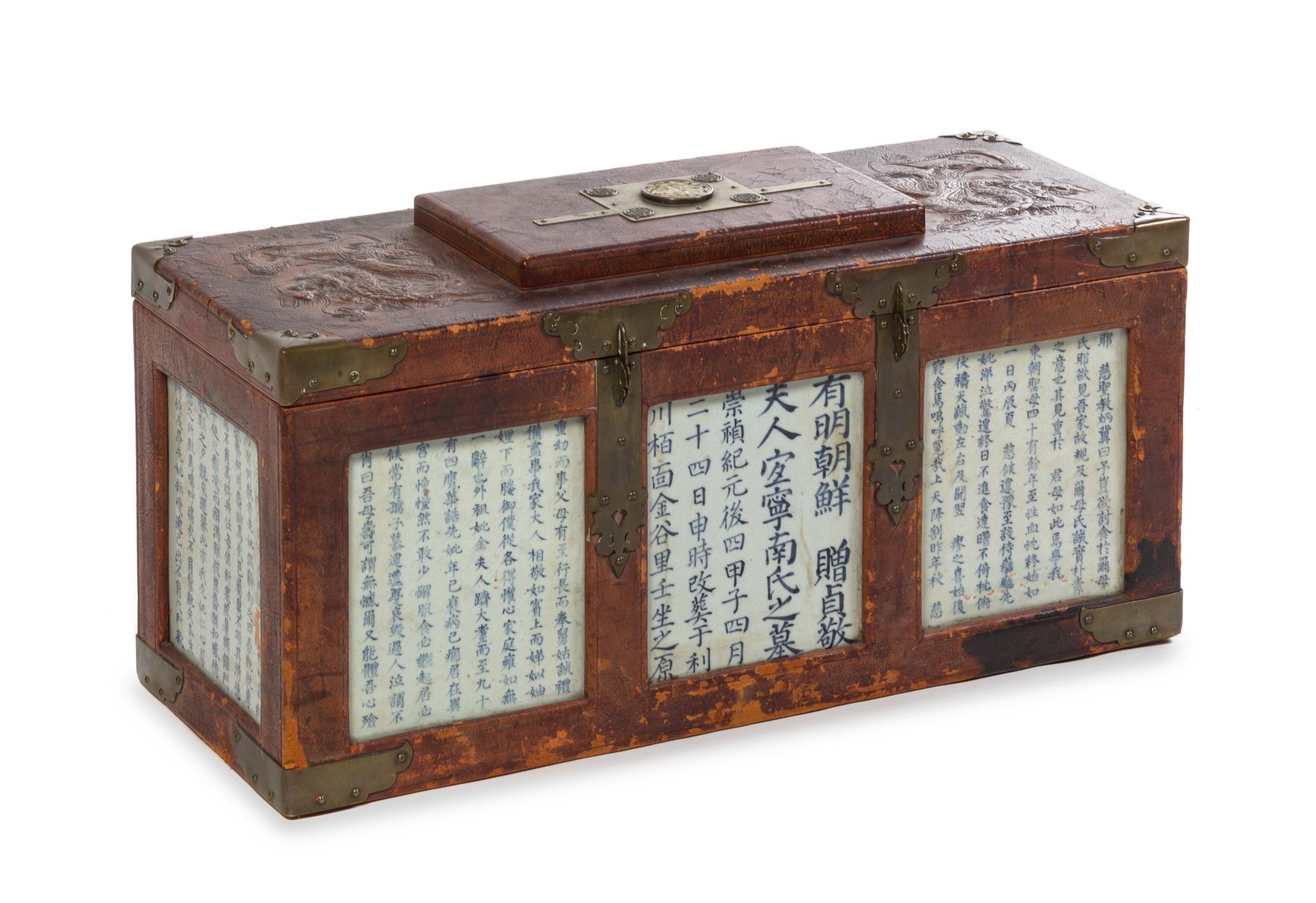 A Large Korean Leather and Porcelain-Inset Chest 18TH/19TH CENTURY Height 14 1/4 x width 29 1/4 x depth 11 1/4 inches. — 18TH/19TH CENTURY