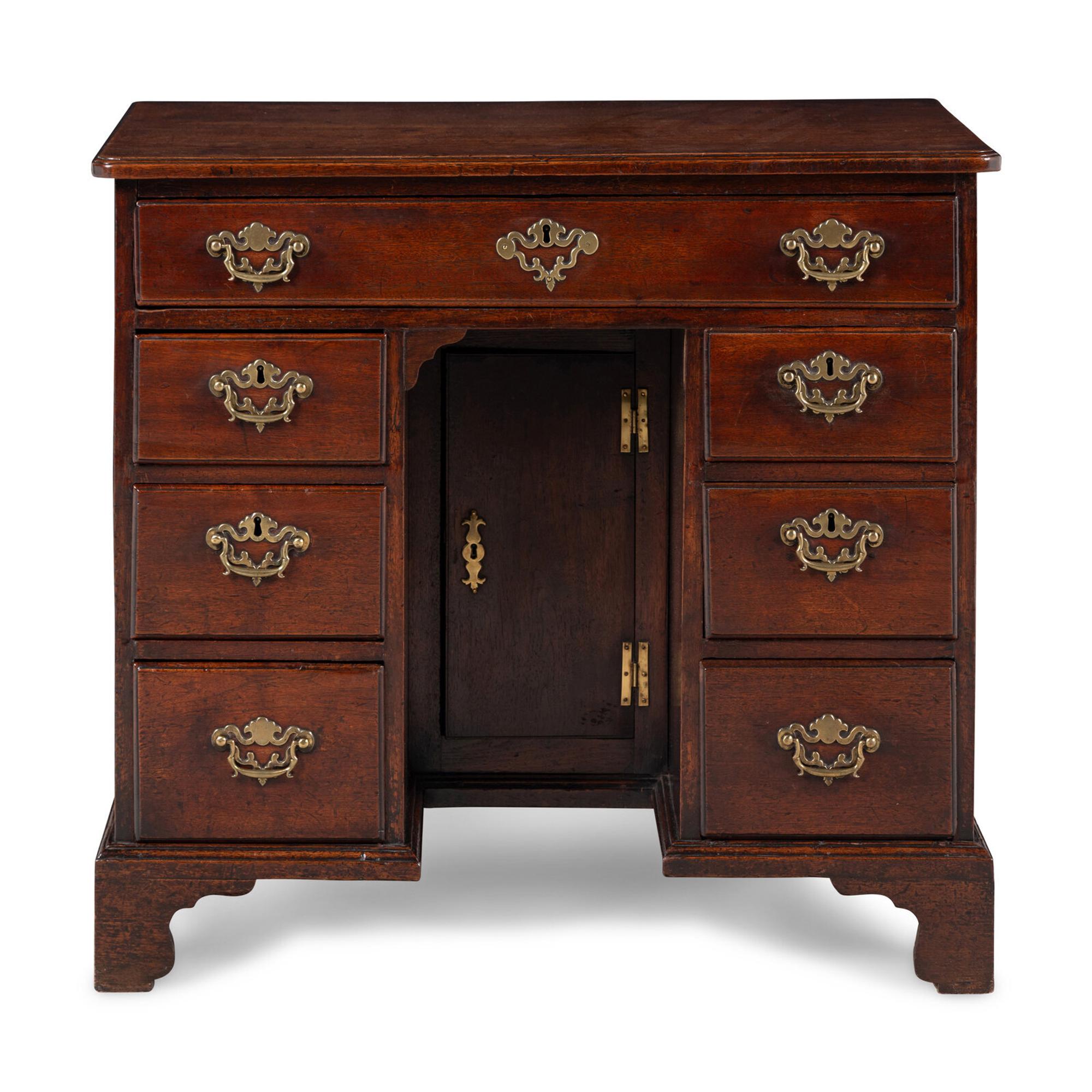 A George II Walnut Kneehole Desk