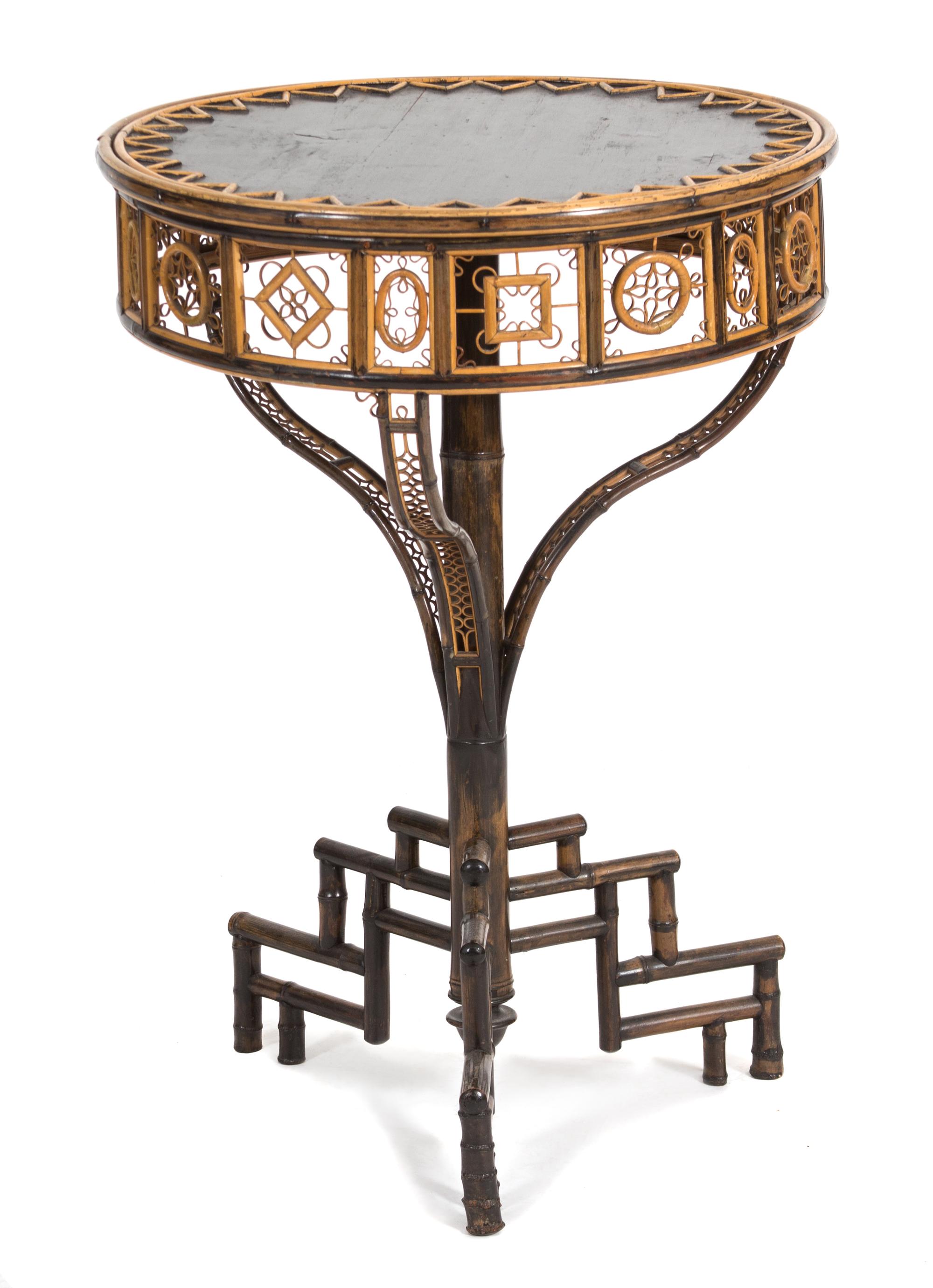 A Victorian Style Bamboo and Ebonized Occasional Table Height 29 x diameter 21 inches. — 20TH CENTURY