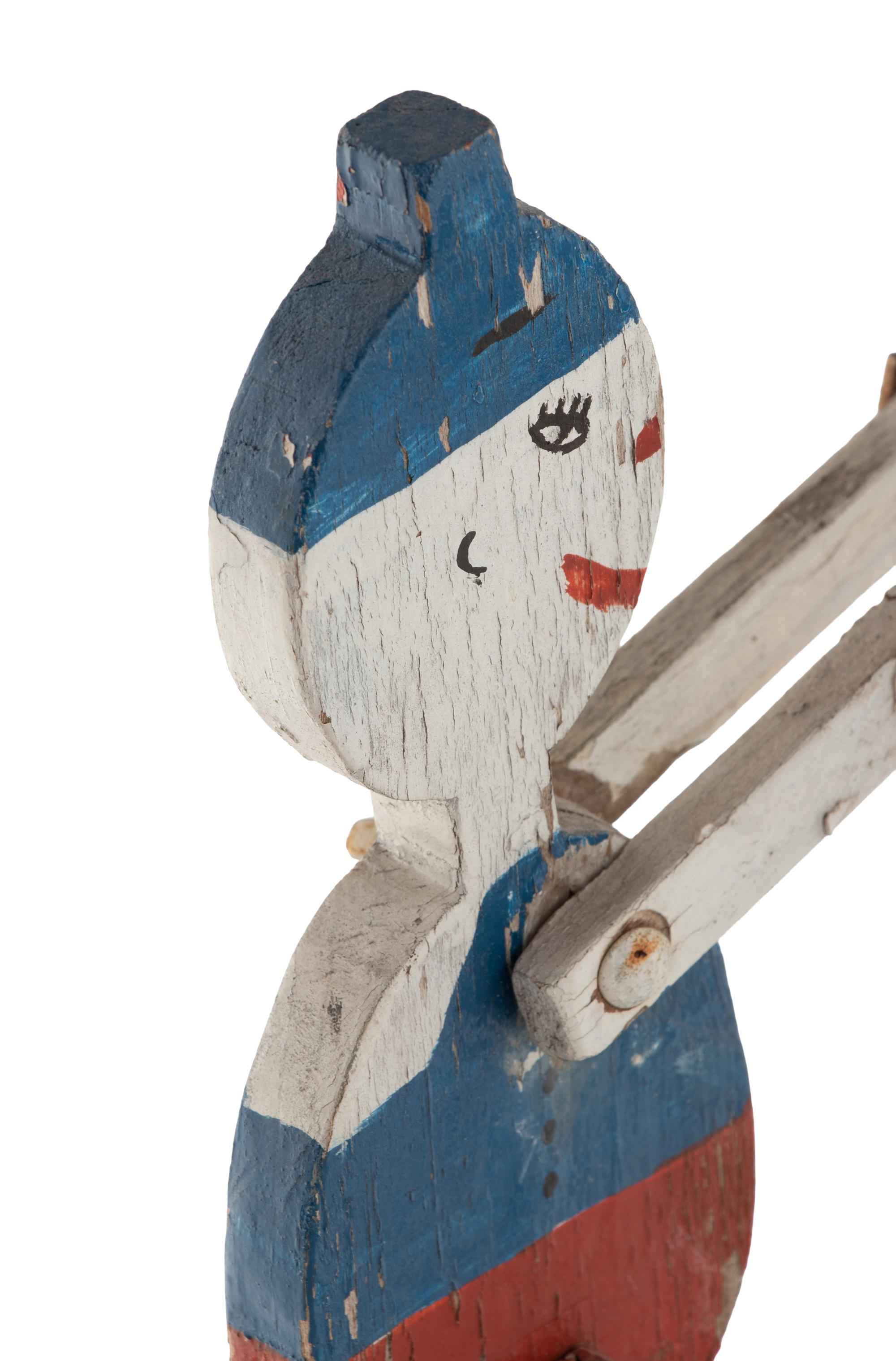 A Painted Wood and Metal Patriotic Figural Whirligig