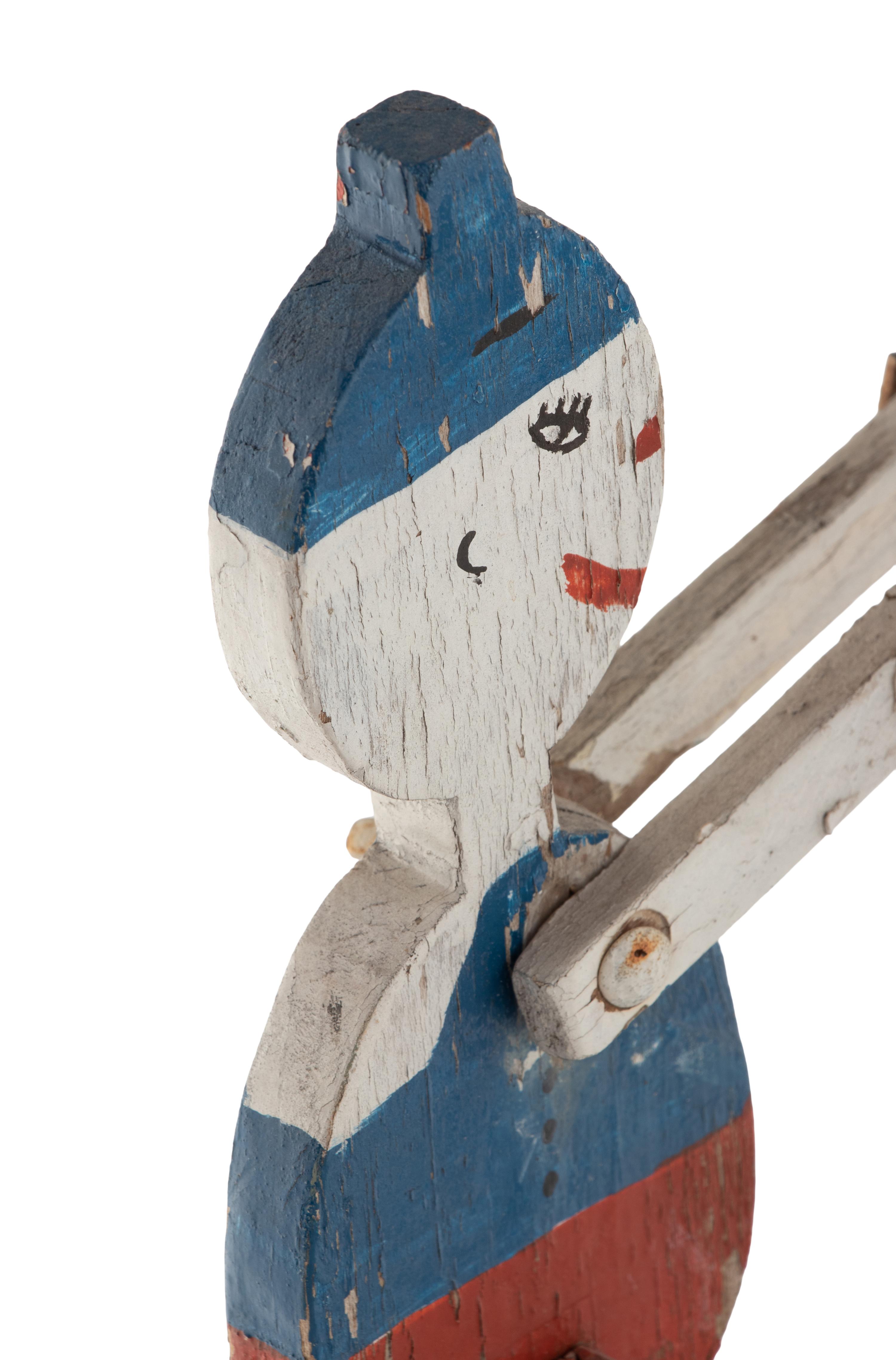 A Painted Wood and Metal Patriotic Figural Whirligig
